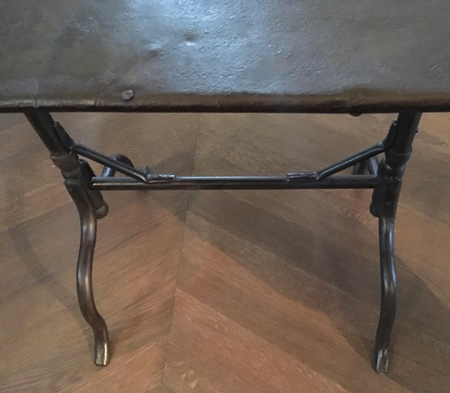 France wrought iron bistrot table with folding top, 1930
Outdoor or indoor use

This is a piece that shows all the signs of the time but for this reason it has a great charm. The iron has cleaned with natural wax to put in evidence the raw beauty of