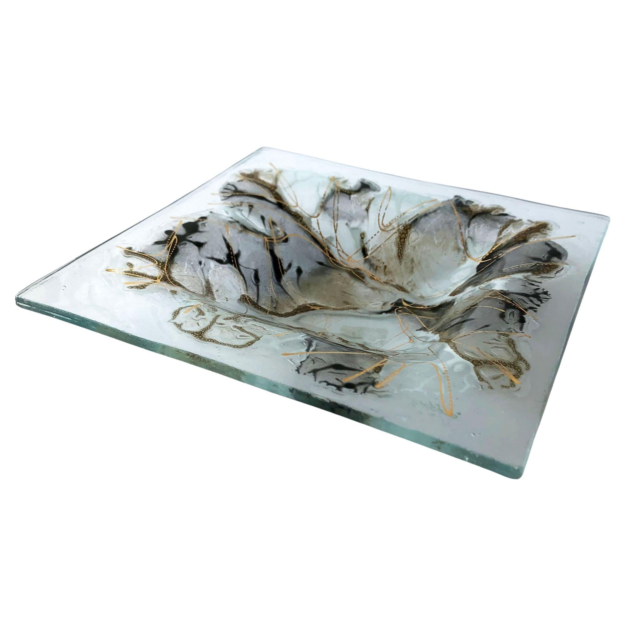 Black and gold abstract design on clear glass tray created by Frances and Micheal Higgins of Riverside, Illinois. Tray measures 7