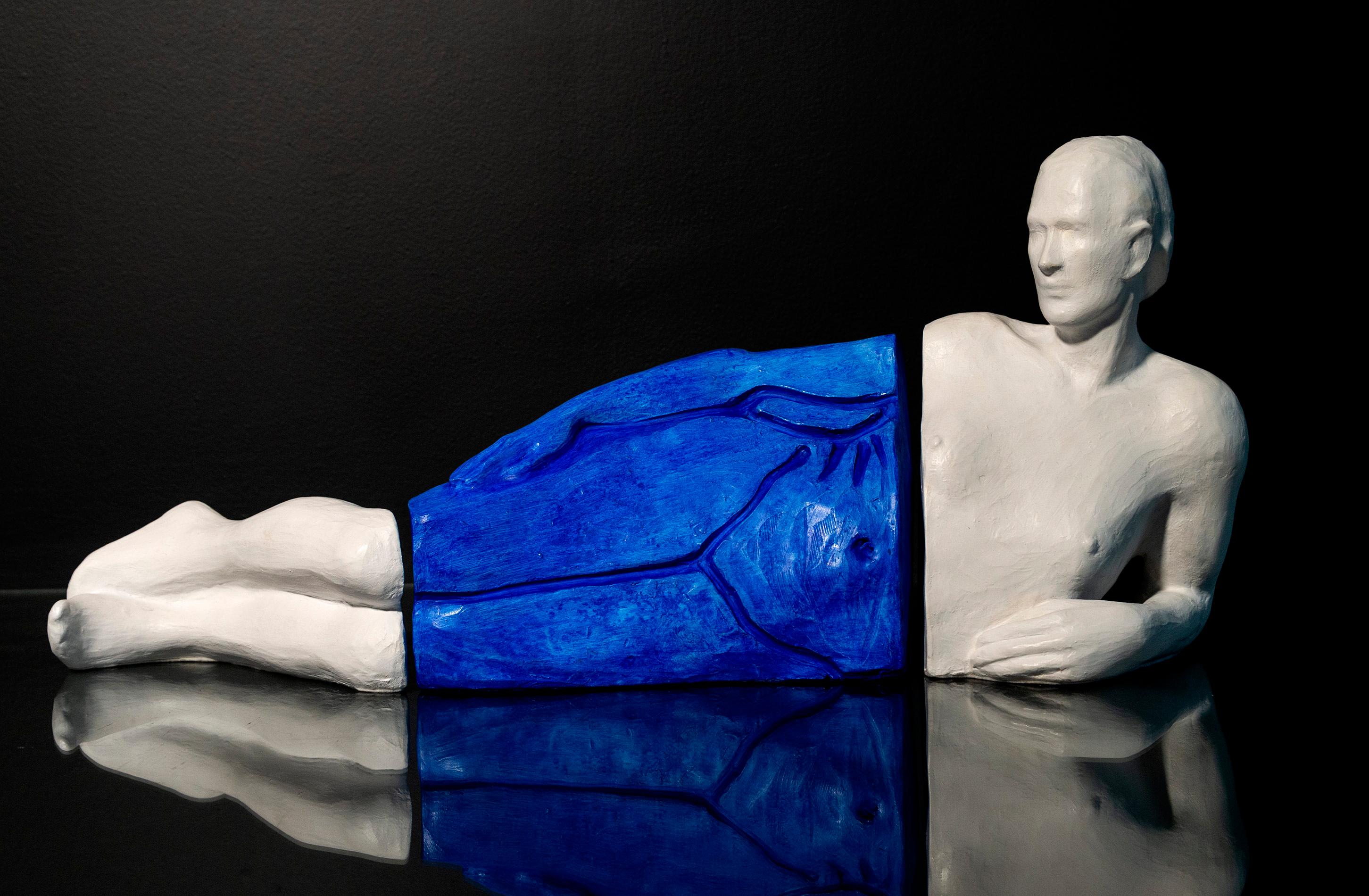 Sculptor Frances Semple has reimagined classic figurative sculpture by playing with form and separating the body into distinct sections. With this tabletop piece, a figure is lying on its side, its head, torso and legs divided. The midsection of the