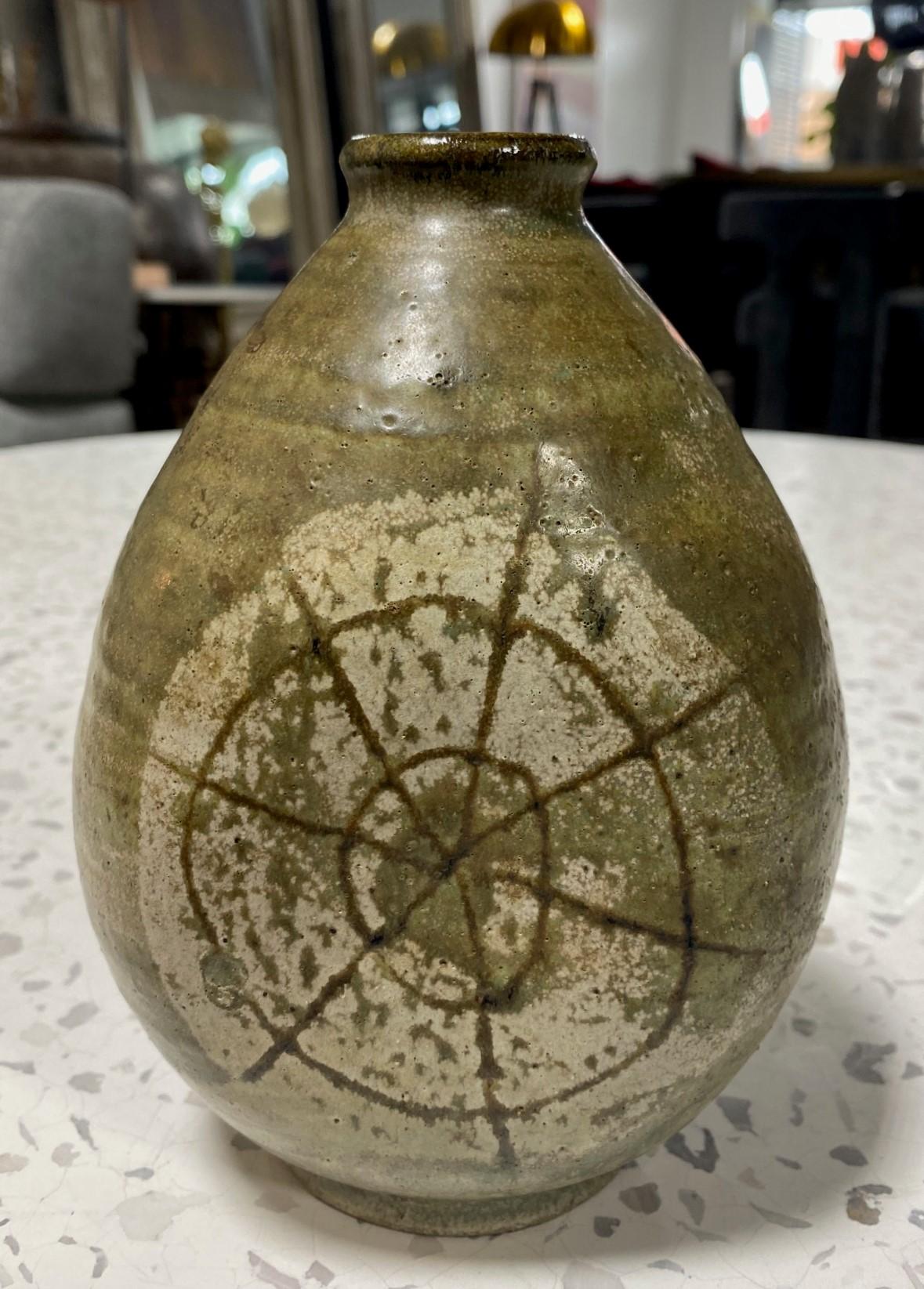 A gorgeous Mid-Century Modern stoneware vase by master potter/artist Frances Senska featuring a beautiful three-sided design, hand-decorated artwork/pattern, and a wonderful earth-tone glaze. 

Frances Senska was a professor who was called the