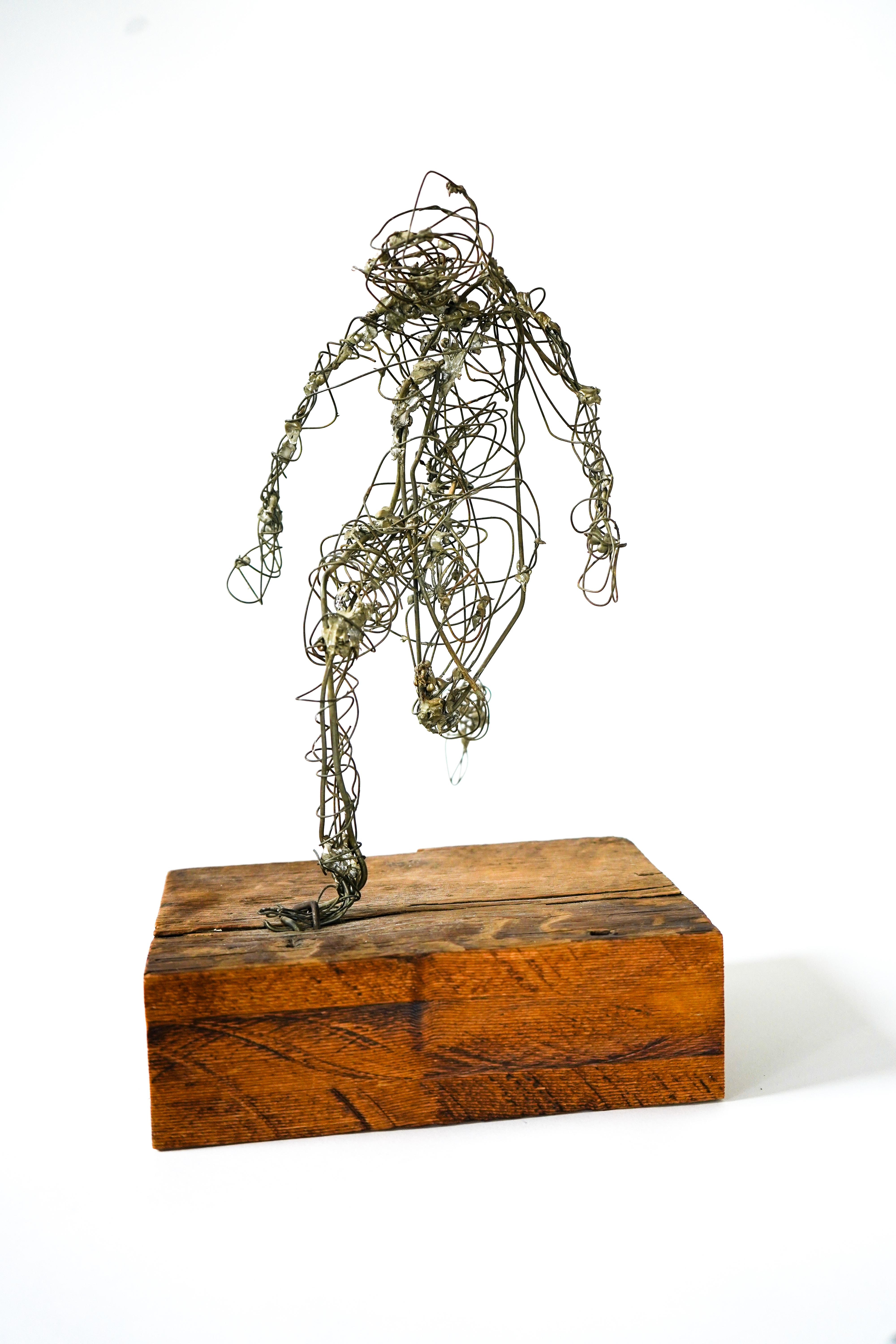 Frances Venardos Gialamas Abstract Wire Figure In Motion Sculpture 1950's. A wonderful work of sculptural art by noted artist Fran Gialamas. The form is crafted from wires and soldered to create an abstract human figure in motion.