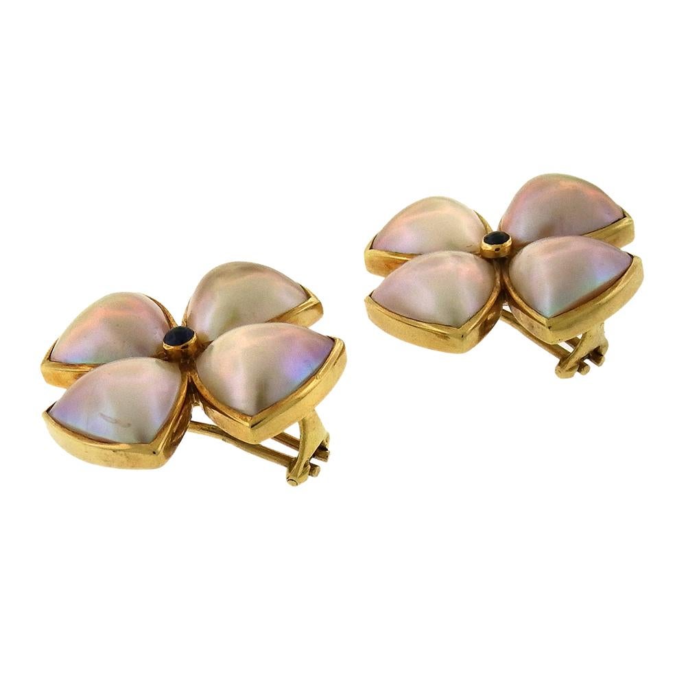 From a private estate, rose-grey triangular mabe pearls are set in 18K gold in these convertible clip-on/post earrings set at center with cabochon sapphire. The earrings measure 1-1/4