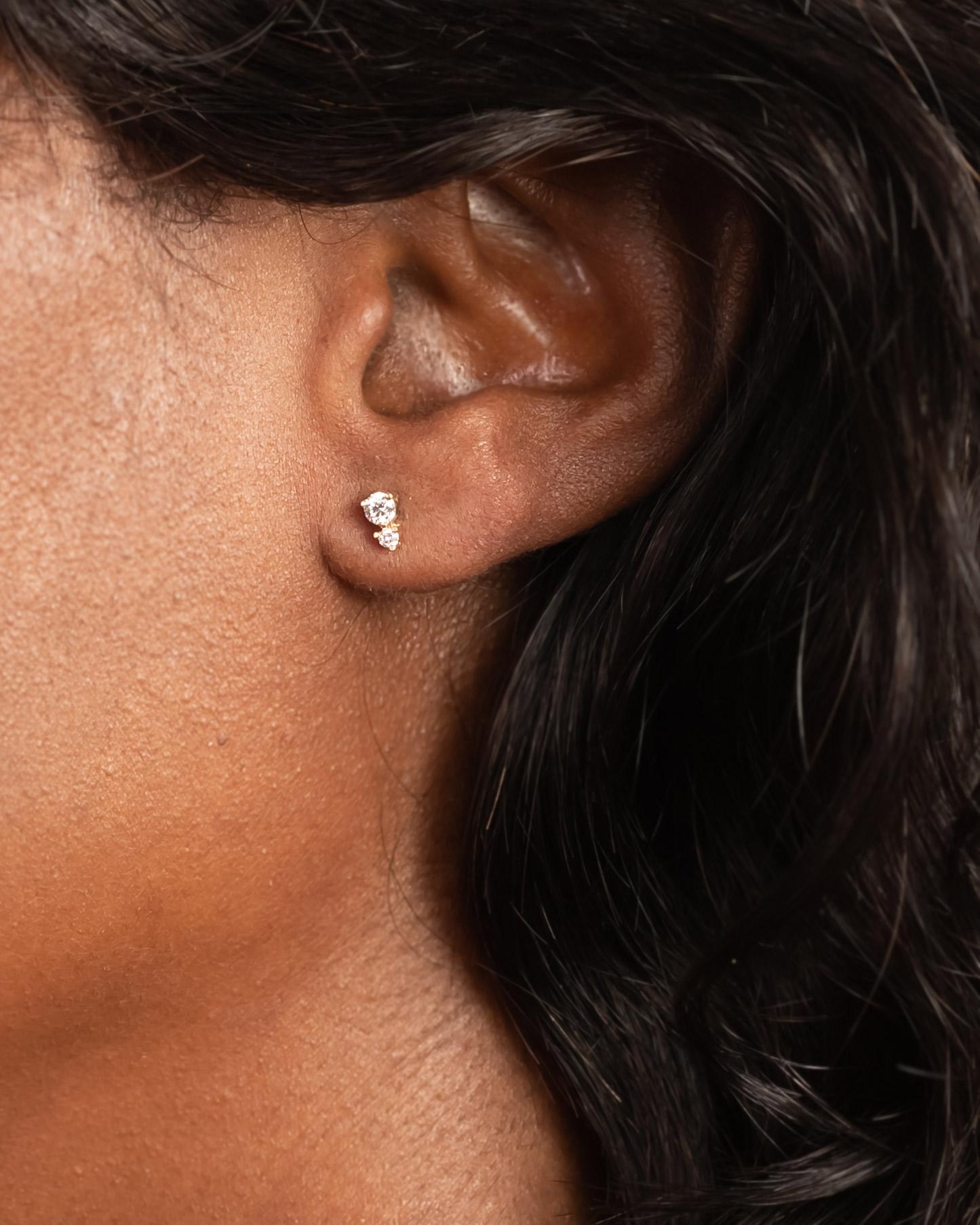 Timeless yet unique and incredibly sparkly, these diamond studs are the perfect addition to your ear game. Constructed in 14k Yellow Gold with double-notched posts for extra security and matching post backs.  

Each item is designed and made to
