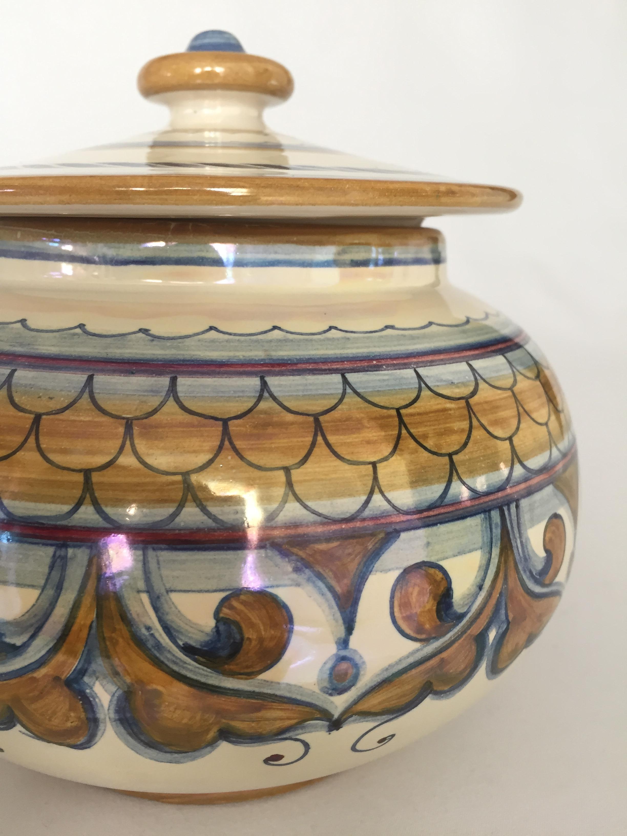 Italian ceramic lidded jar with Majolica glaze, handcrafted by master ceramicist Francesca Niccacci. In 1975, she opened her own studio, Vecchia Deruta.
Her work is featured in many museums and churches worldwide, and greatly influenced by the