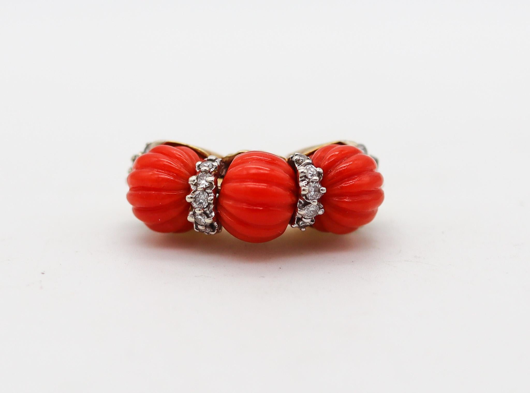 Neapolitan ring with red coral designed by Francesco Passaretta.

Gorgeous vintage piece made in the city of Napoles in Italy, at the jewelry atelier of Francesco Passaretta back in the 1970. This beautiful colorful ring has been crafted in solid