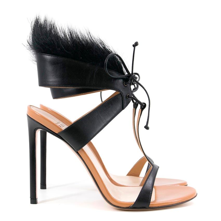 Francesco Russo fur embellished leather sandals. T-strap with leather tie up feature at the front of the ankle. Fur detail on the ankle strap. Tan leather lining. 

Condition: 9.5/10 
Minor storage scuff around the toe lining. Minor wrinkling