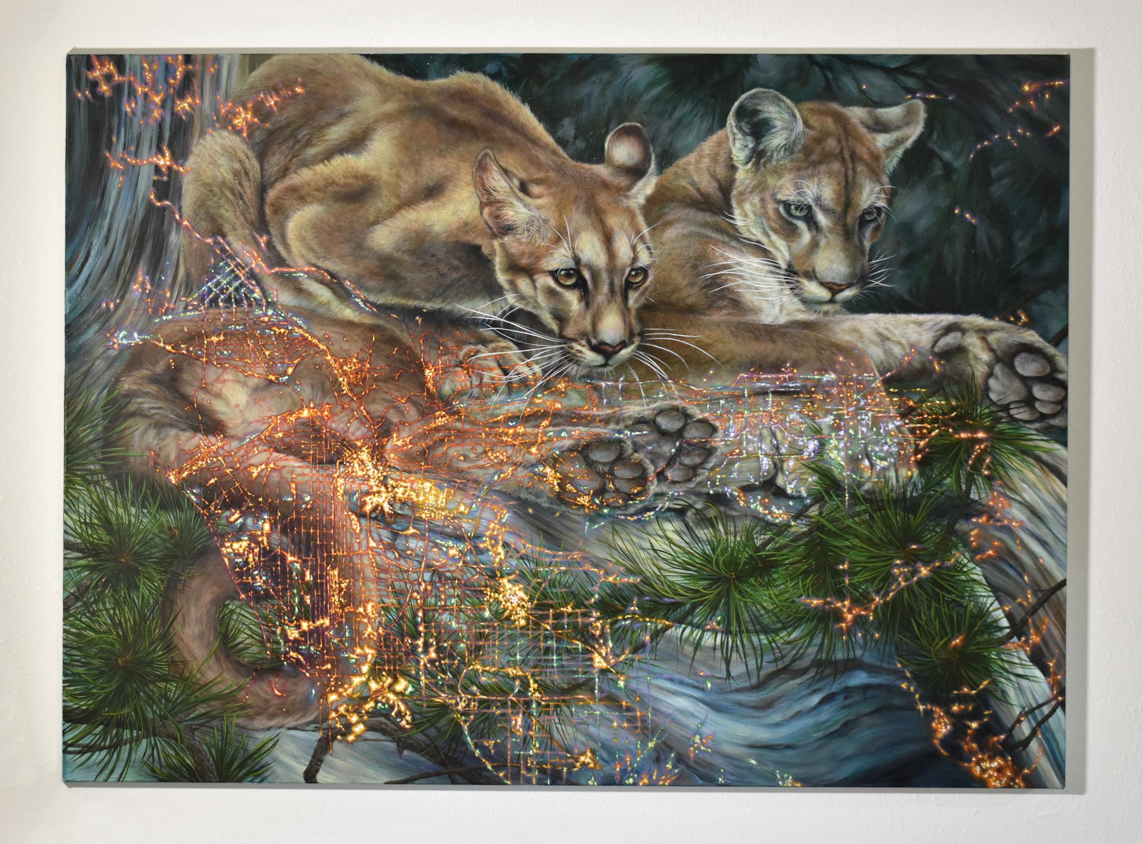 Two mountain lions in dynamic, powerful poses are dramatic and meticulously painted, layered beneath an intricately detailed map of Los Angeles in bright shimmering gold and branches of a verdant green pine tree. In this oil painting with mica