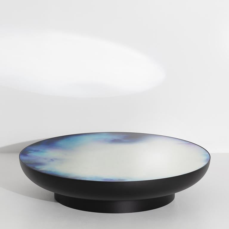 Francis collection starts with a painter brush resting in a glass of water, when watercolour pigments reveal shifting drawings. Constance Guisset launched the collection in 2012 with a mirror and added coffee tables in 2019. Lying horizontally, the
