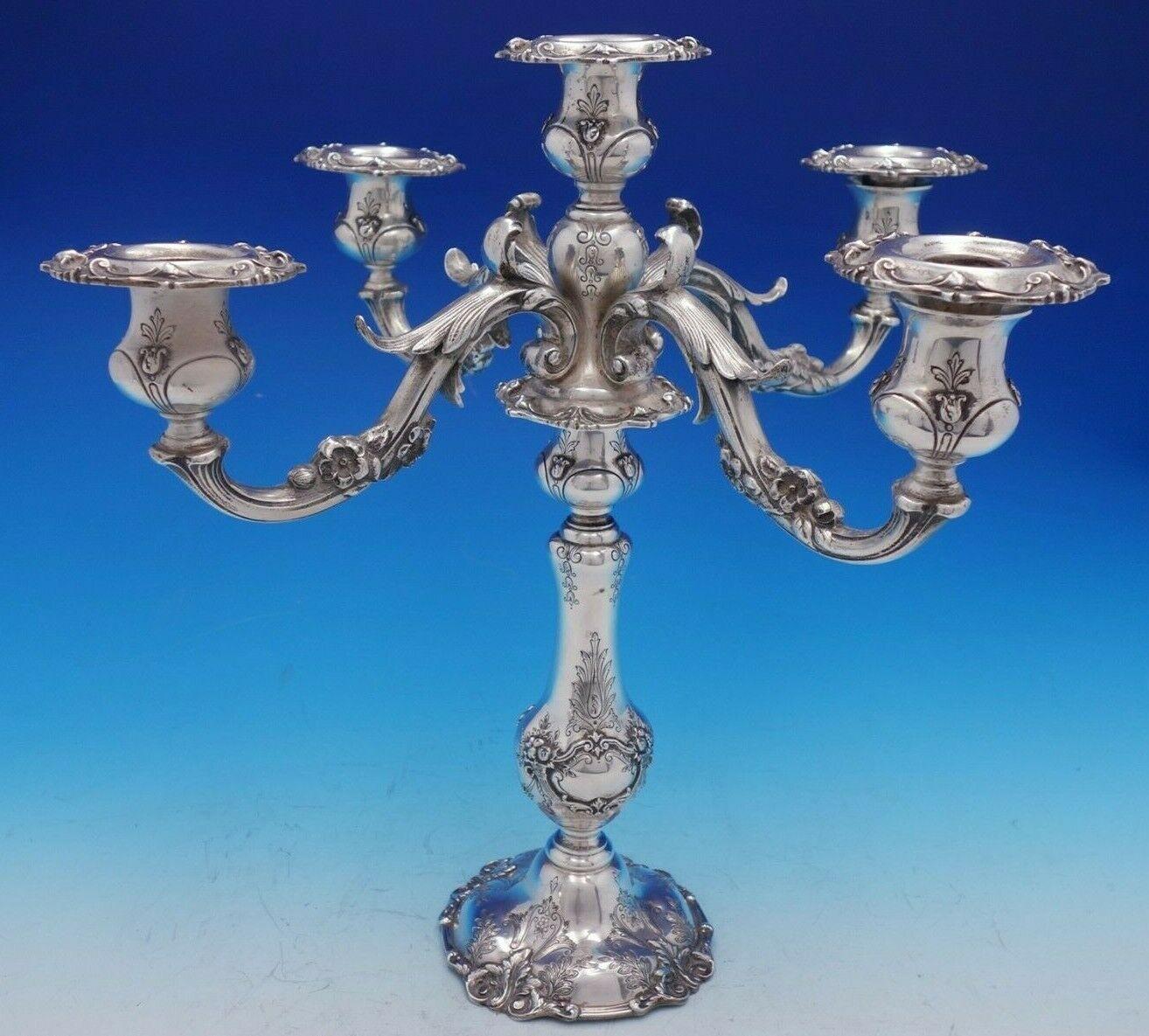 Reed & Barton

Superb Francis I Old by Reed & Barton weighted sterling silver pair of five light, hand chased, candelabras with cast flower arms marked #570A. Each measures 15