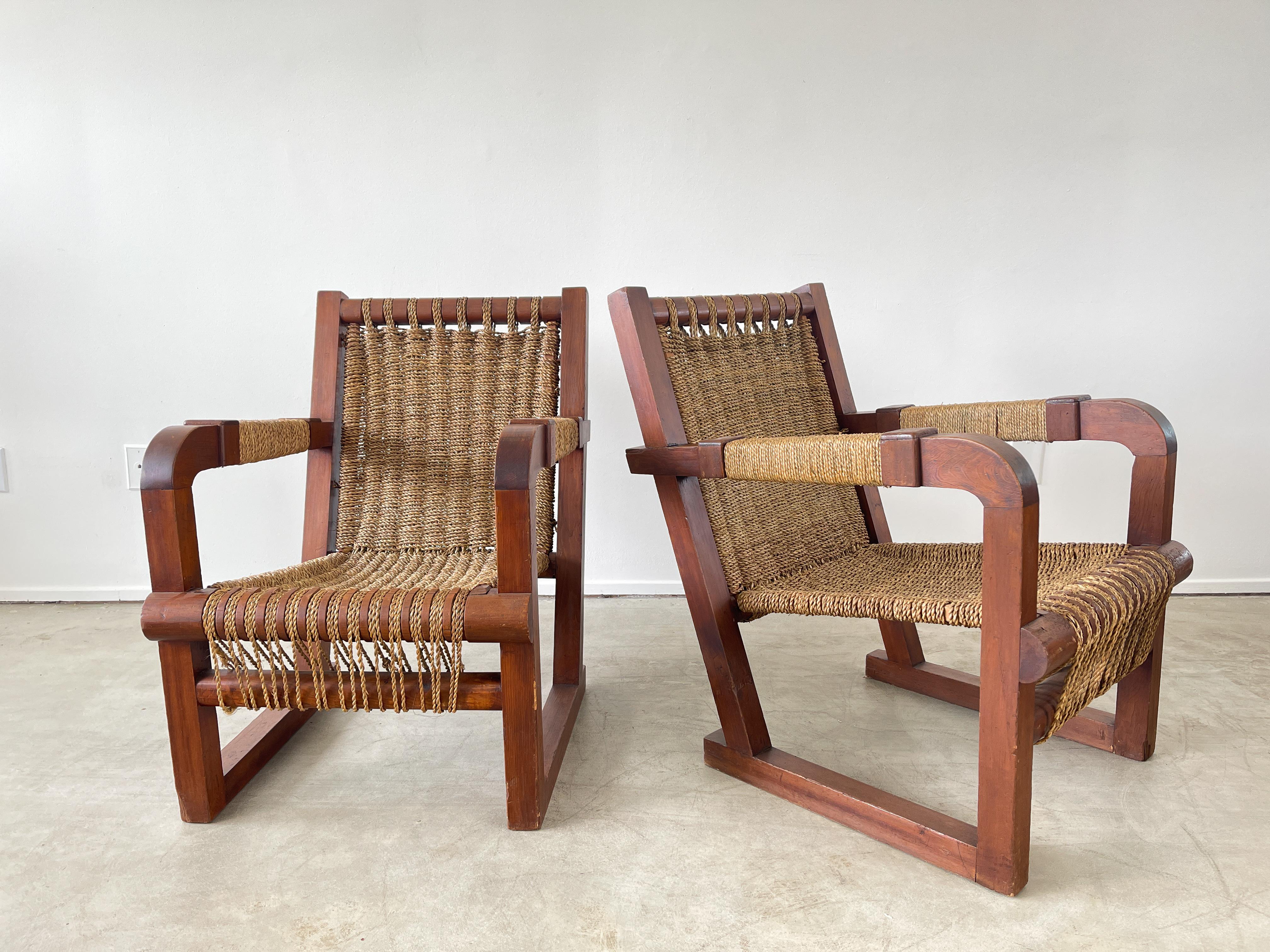Pair of Francis Jourdain attributed chairs with incredible woven rope seats, back and arms. 
Bentwood armed detailing on oak frames. 
Great from ever angle with wonderful patina.