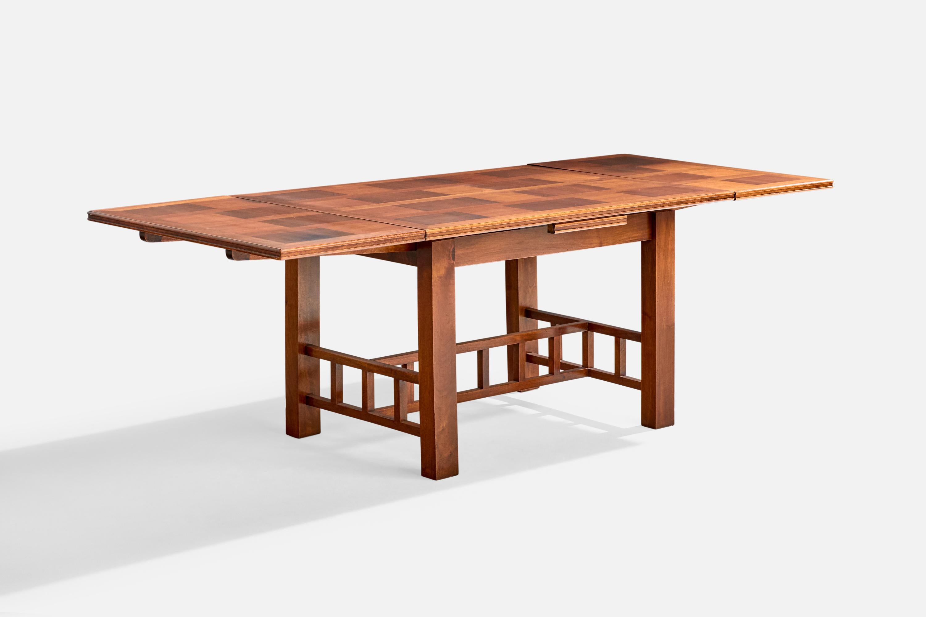 An extendable mahogany dining table attributed to Francis Jourdain, France, c. 1915.

Wear consistent with age and use

Overall Dimensions (inches): 29.5