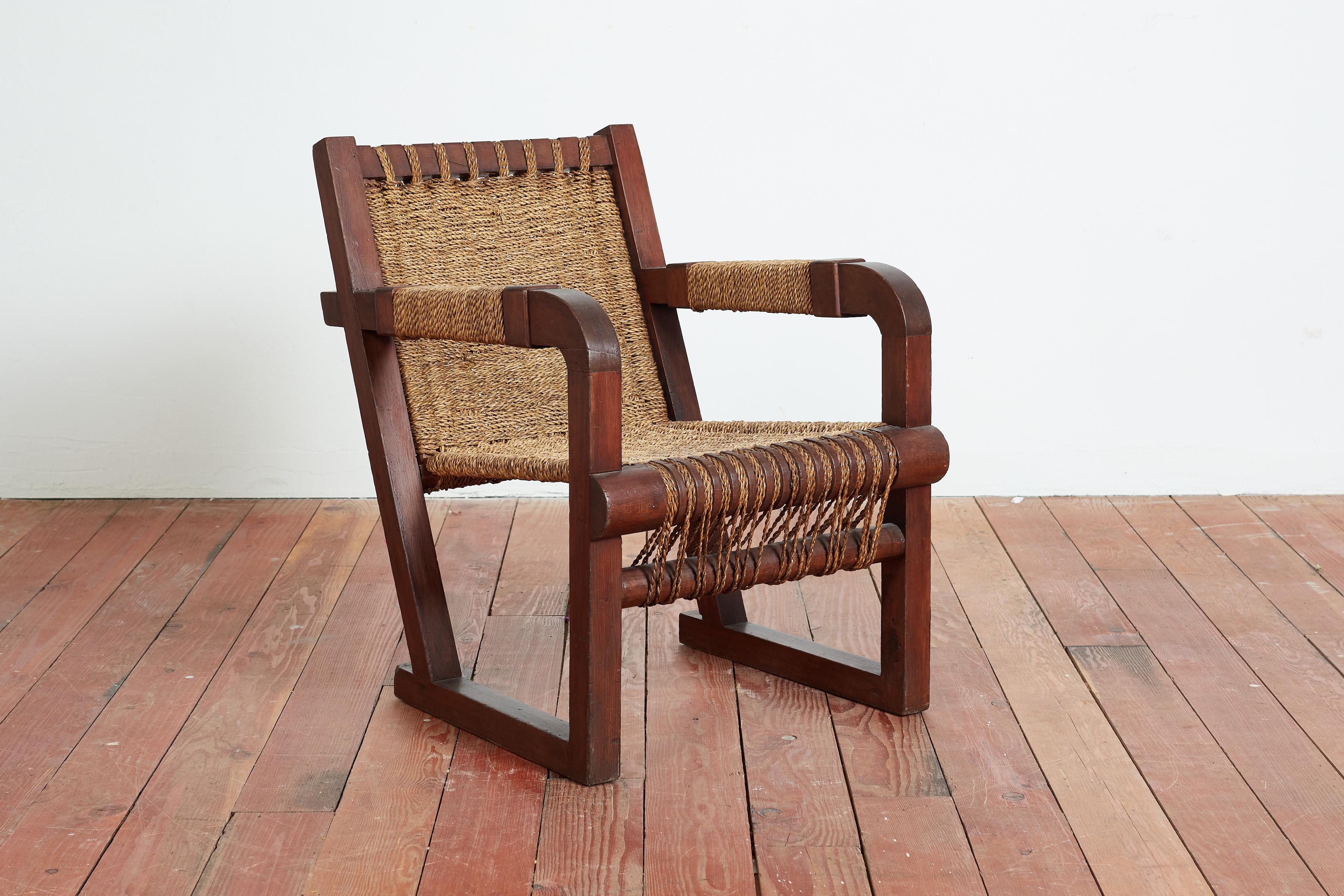 Francis Jourdain chair with incredible woven rope seat, back and arms. 
Great from every angle with wonderful patina.

France, 1940s. 