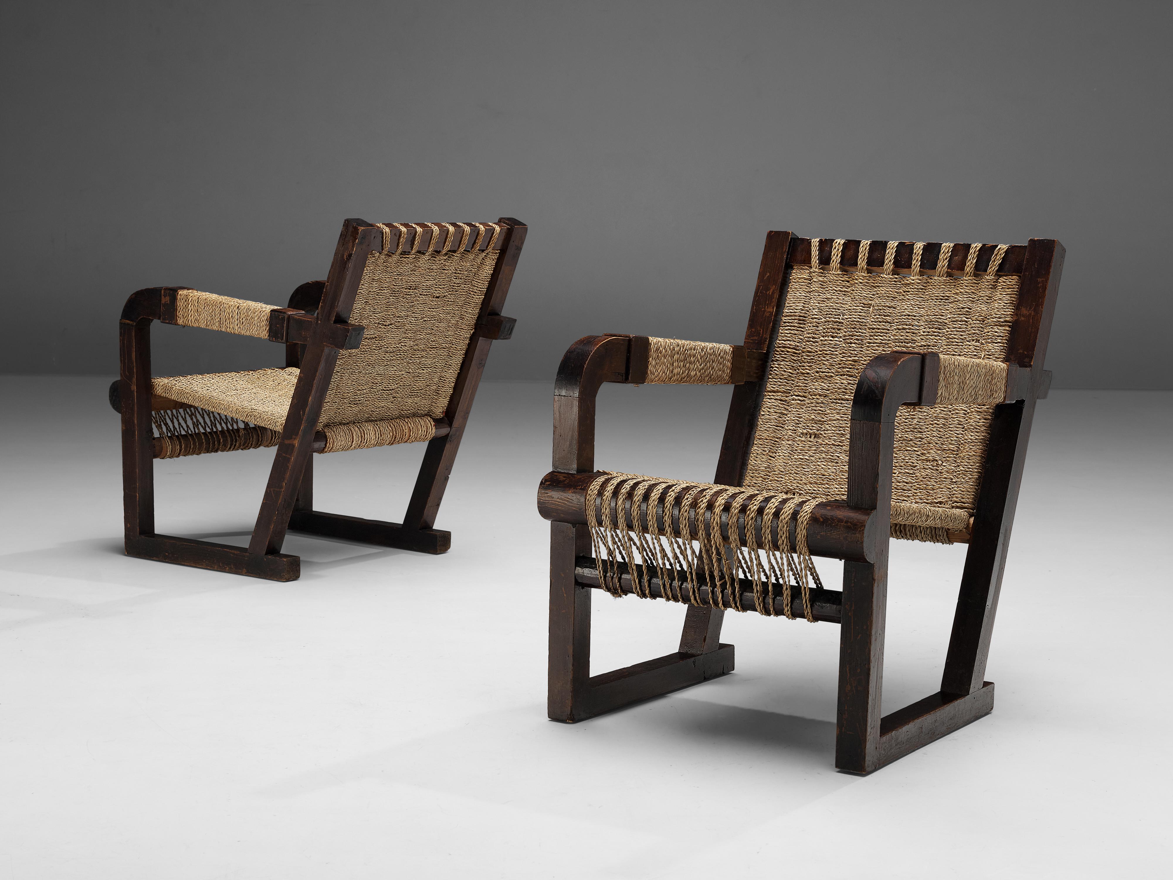 Francis Jourdain, pair of lounge chairs, pine, rope, France, 1930s

This stunning pair of lounge chairs was designed by Francis Jourdain in France around 1930. The chair show a raked back and the seat is created out of intertwined rope strings.