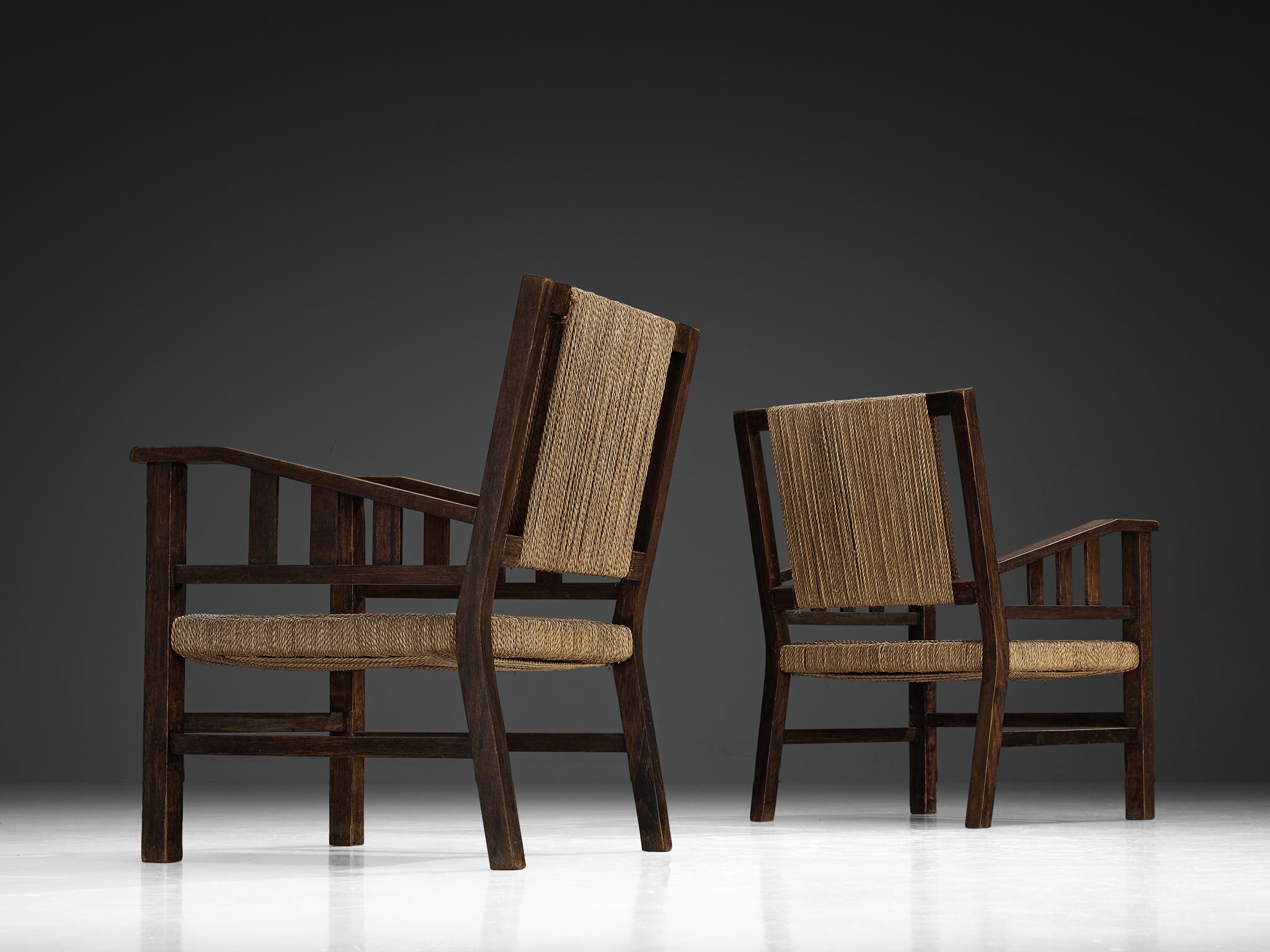 Paille Francis Jourdain Paire de chaises longues en paille tressée et Wood
