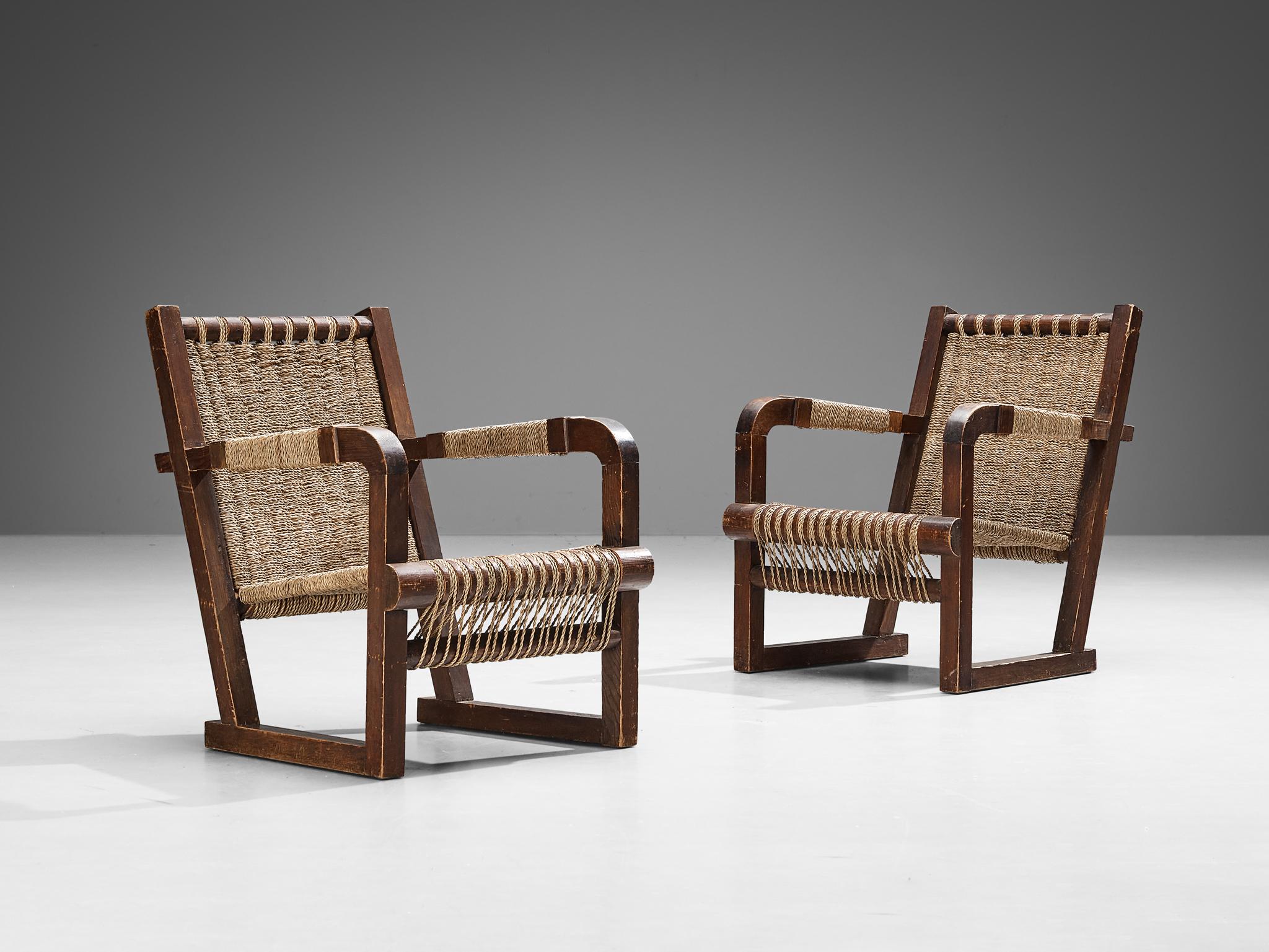 Francis Jourdain, pair of lounge chairs, dark stained pine, straw, France, 1930s

This stunning pair of armchairs was designed by Francis Jourdain in France around 1930. The easy chair shows a raked back and the seat is created out of intertwined