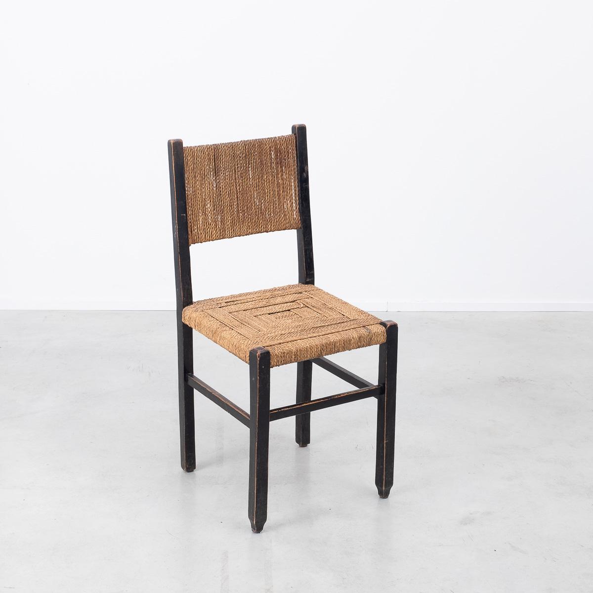 Elegant rope and ‘Bois Noirci’ wood chair by Francis Jourdain. Jourdain was a well known French writer, designer, artist and political activist. He opened up a small atelier in 1912 that specialised in producing modular wooden furniture for the