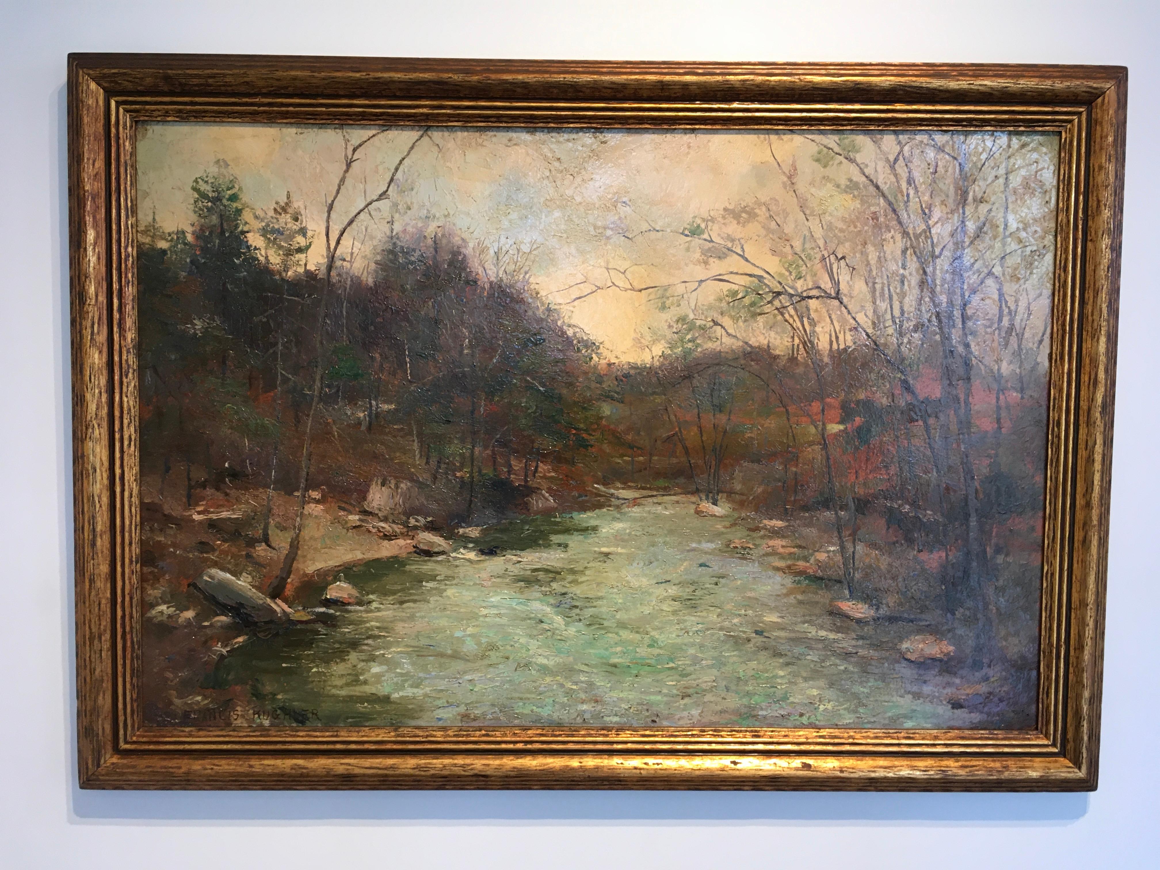 This Mid-century Oil on Panel Landscape by Francis Kughler measures 28 1/2" x 40 x 1 1/2", and features a gold-colored wood frame. A hilly landscape of trees rendered in fall colors flanks the rocky bands of a shallow blue stream that disappears
