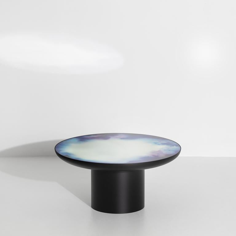 Francis collection starts with a painter brush resting in a glass of water, when watercolour pigments reveal shifting drawings. Constance Guisset launched the collection in 2012 with a mirror and added coffee tables in 2019. Lying horizontally, the