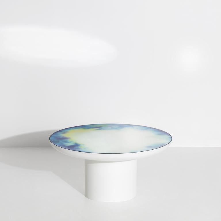 Francis collection starts with a painter brush resting in a glass of water, when watercolour pigments reveal shifting drawings. Constance Guisset launched the collection in 2012 with a mirror and added coffee tables in 2019. Lying horizontally, the