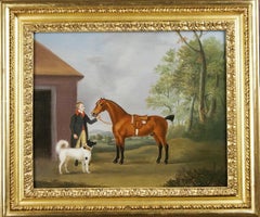 A bay horse with groom and dog