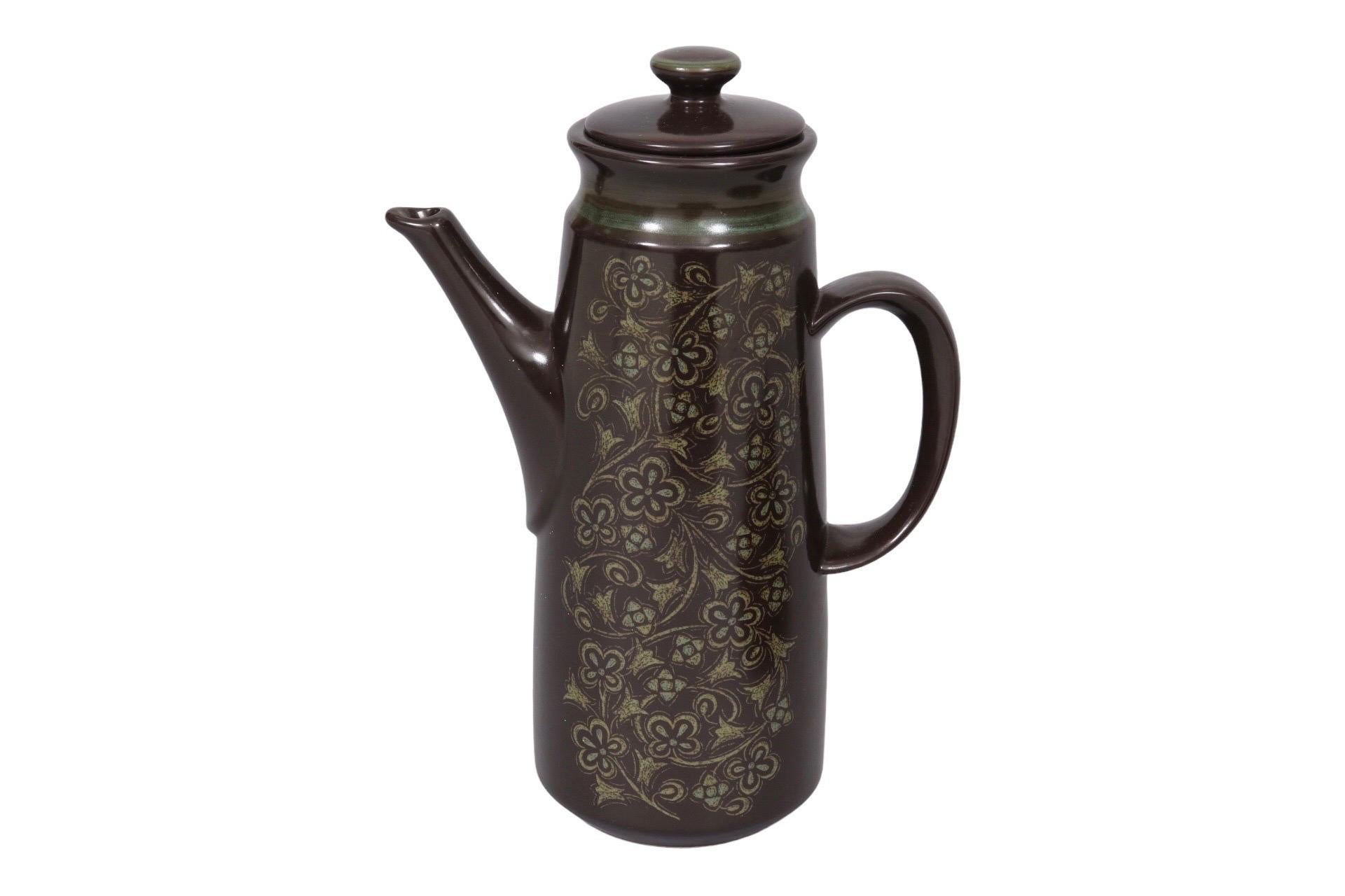 An earthenware coffee service made in the USA by Franciscan, in their ‘Madeira’ pattern, produced between 1967 and 1983. A mid century tan floral motif scrolls across the body of the coffee pot and the face of the platter in dark brown, also