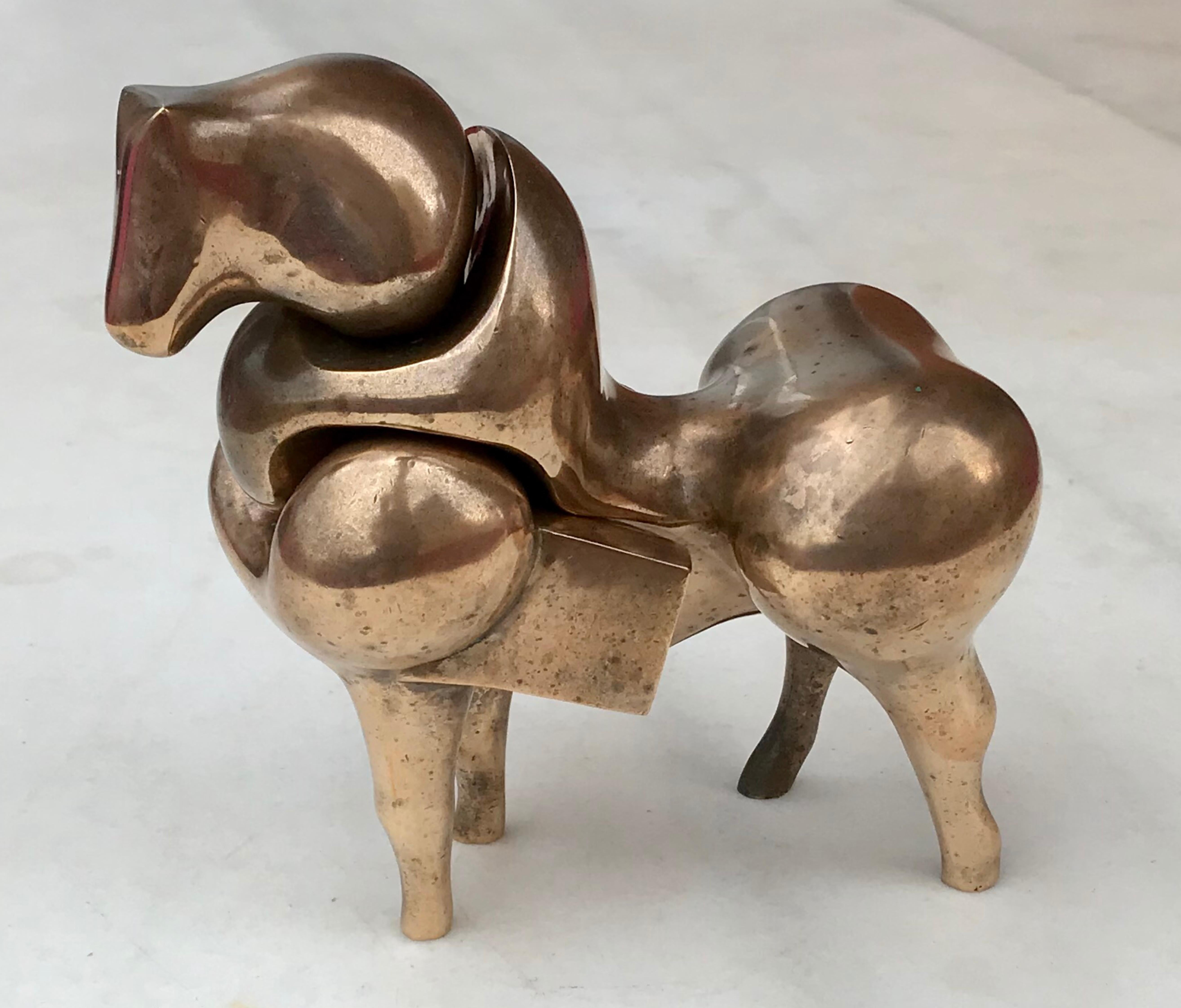 A bronze sculpture of a bull by Francisco Baron, signed and numbered by the artist, this cleverly sculpted piece consists of two parts slid into to each other to resemble a stylized bull.