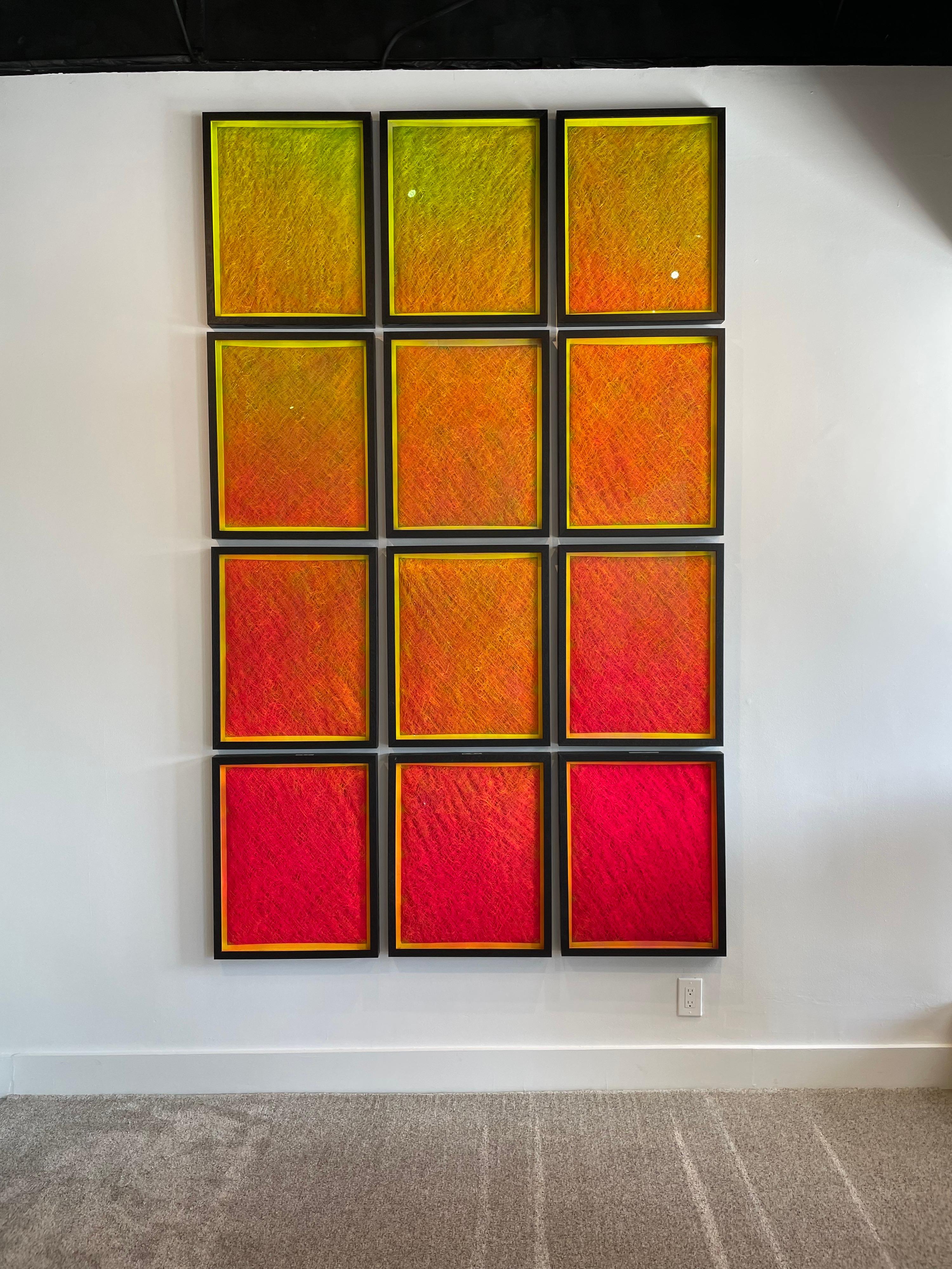 This is a MONUMENTAL art installation comprised of 12 unique framed painted air filters in a continuous color formation by Spanish artist/painter, Francisco Franco. Completely versatile in its options for displaying this arrangement, can be split in