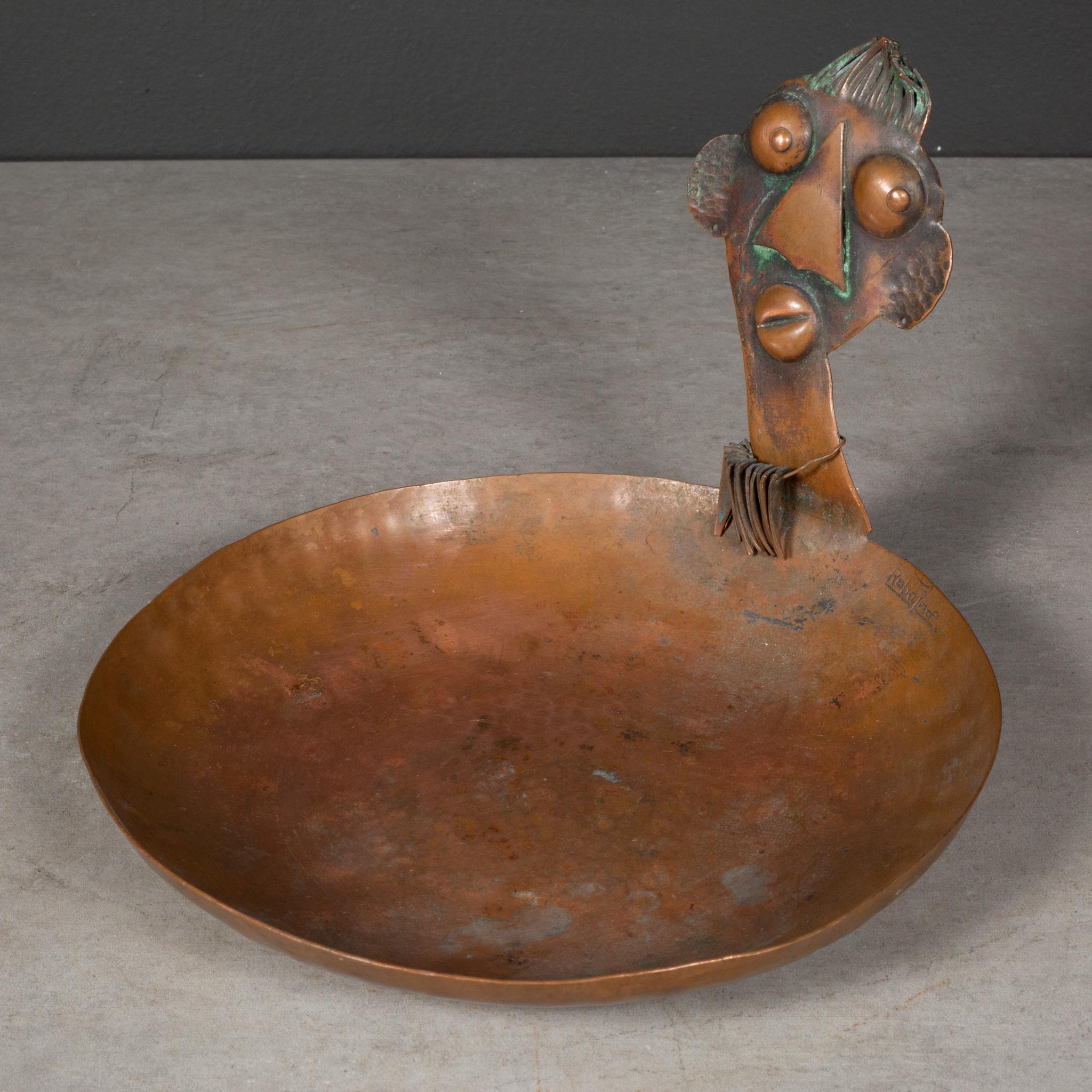 ABOUT

A mid-century copper trinket dish designed by Francisco Rebajes using his iconic African Ubangi tribe member and necklace motive. Stamped 