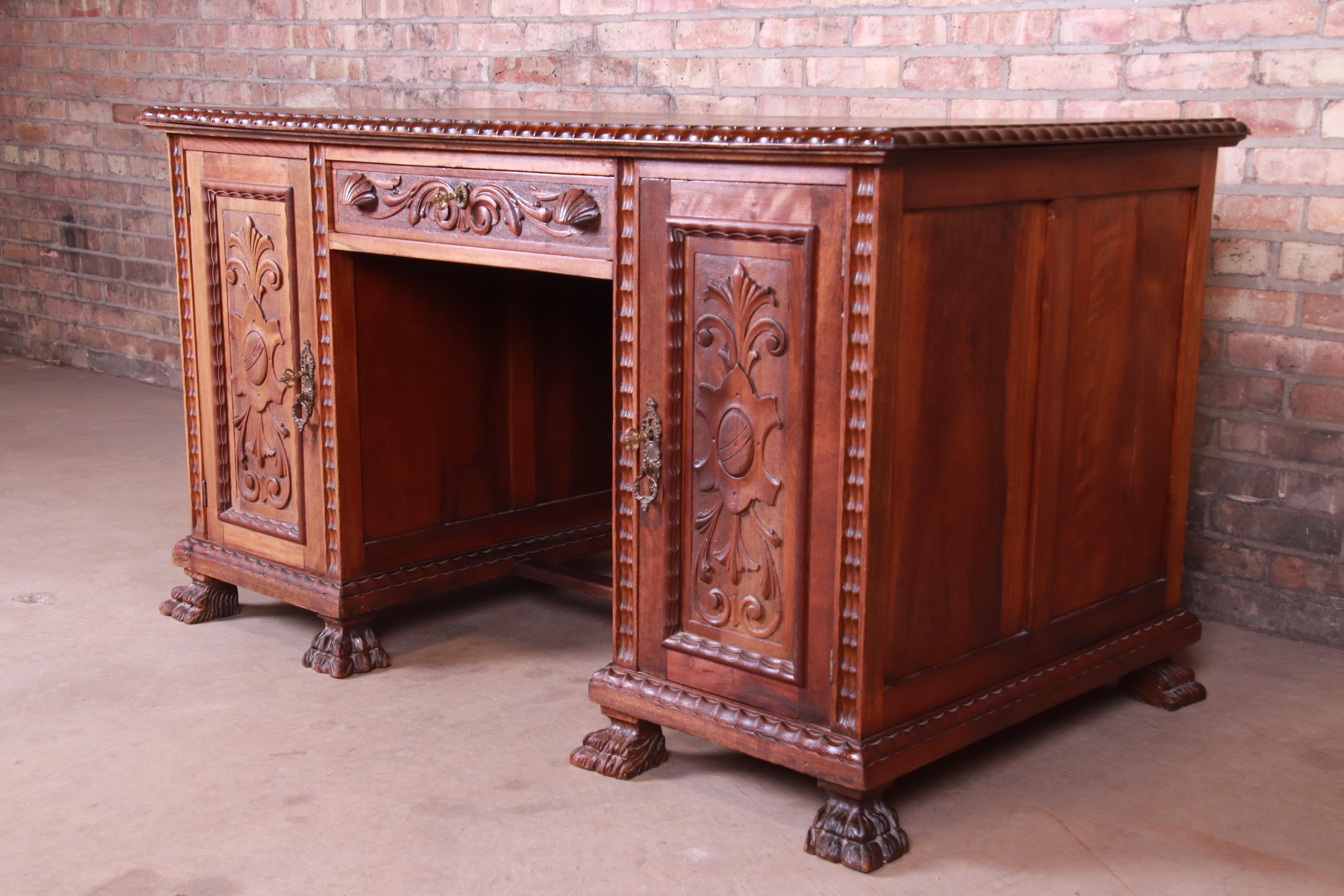 Renaissance Revival Francisco Sobrinho Ornate Carved Walnut Desk and Chair, Brazil, 1930s