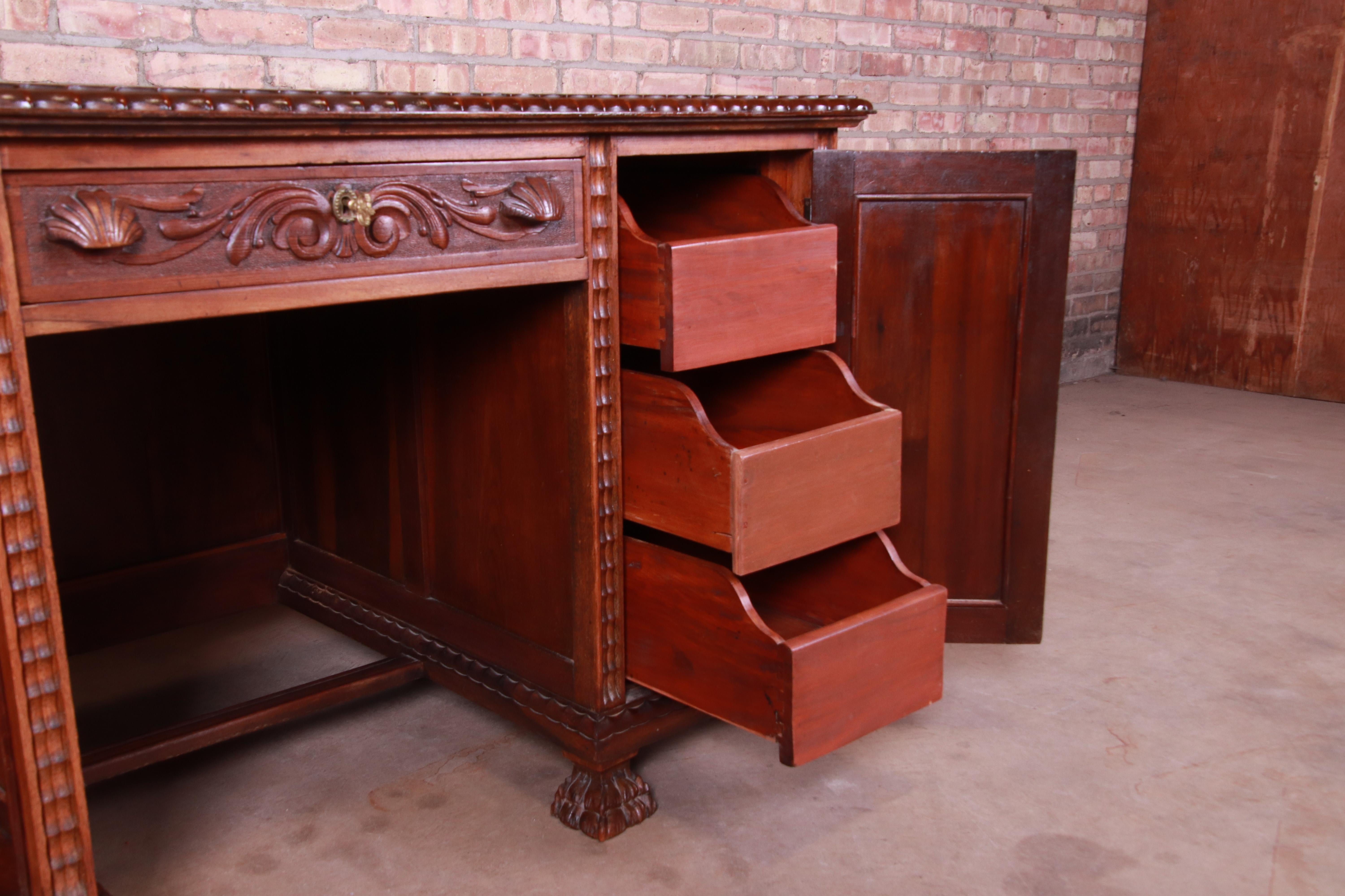 Francisco Sobrinho Ornate Carved Walnut Desk and Chair, Brazil, 1930s In Good Condition In South Bend, IN