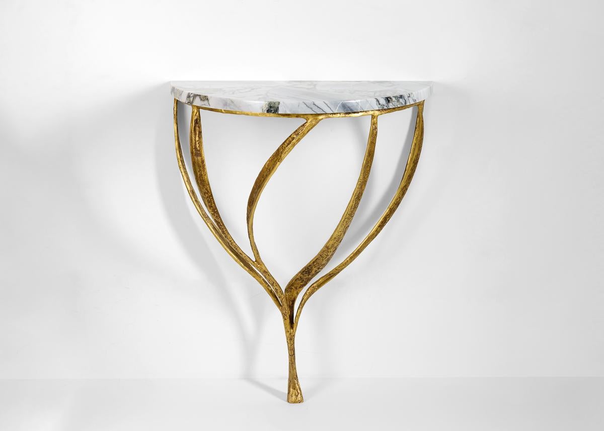 Franck Evennou has a poetic language inspired by nature, and by all subjects that carry the residue of their pasts. His works, particularly in bronze, like this elegant side table, possess a powerful nostalgic quality, capturing in sculptural