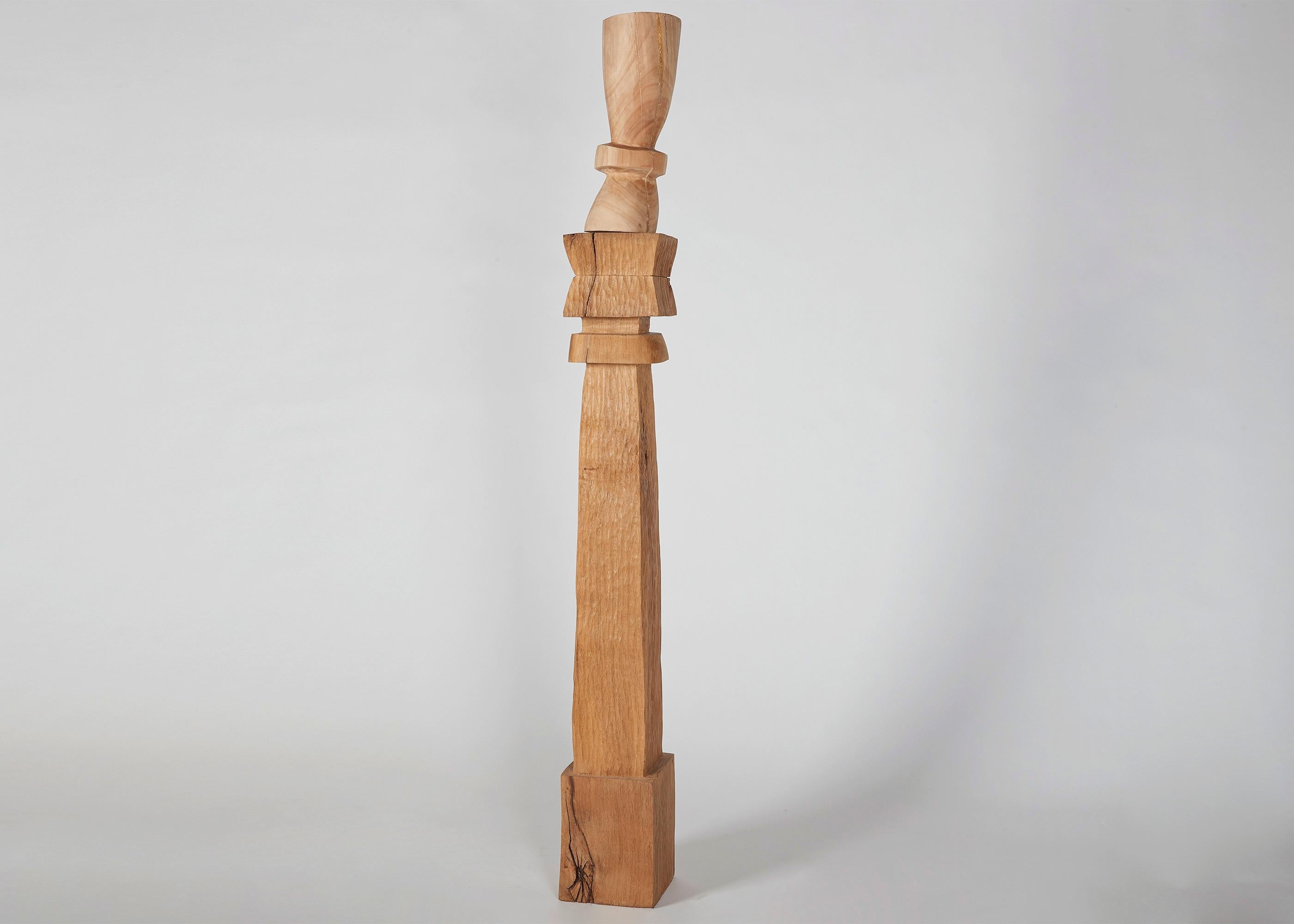 The totems of the French sculptor Franck Evennou possess a playful quality that counterbalances the traditional solemnity of the form. With their rough, splitting surface, they are not merely true in spirit to the wood from which they are carved,