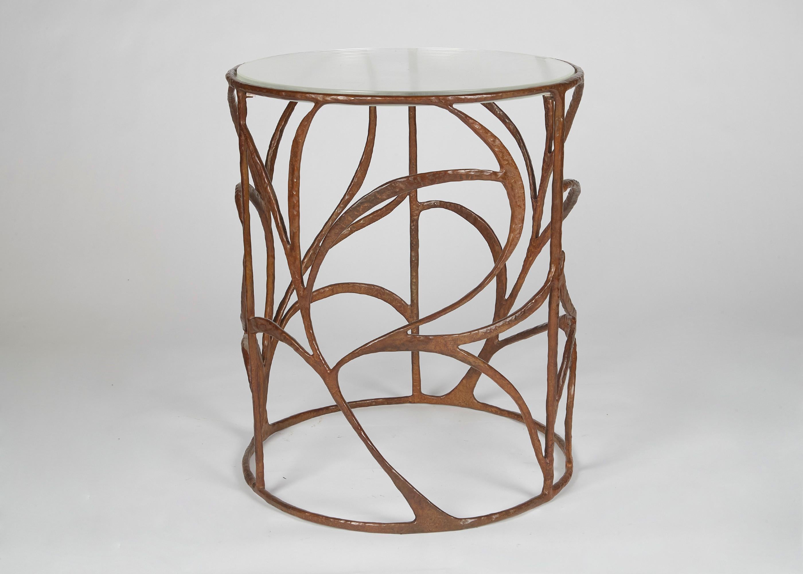 Franck Evennou has a poetic language inspired by nature, and by all subjects that carry the residue of their pasts. His works, particularly in bronze, like this elegant side table, possess a powerful nostalgic quality, capturing in sculptural