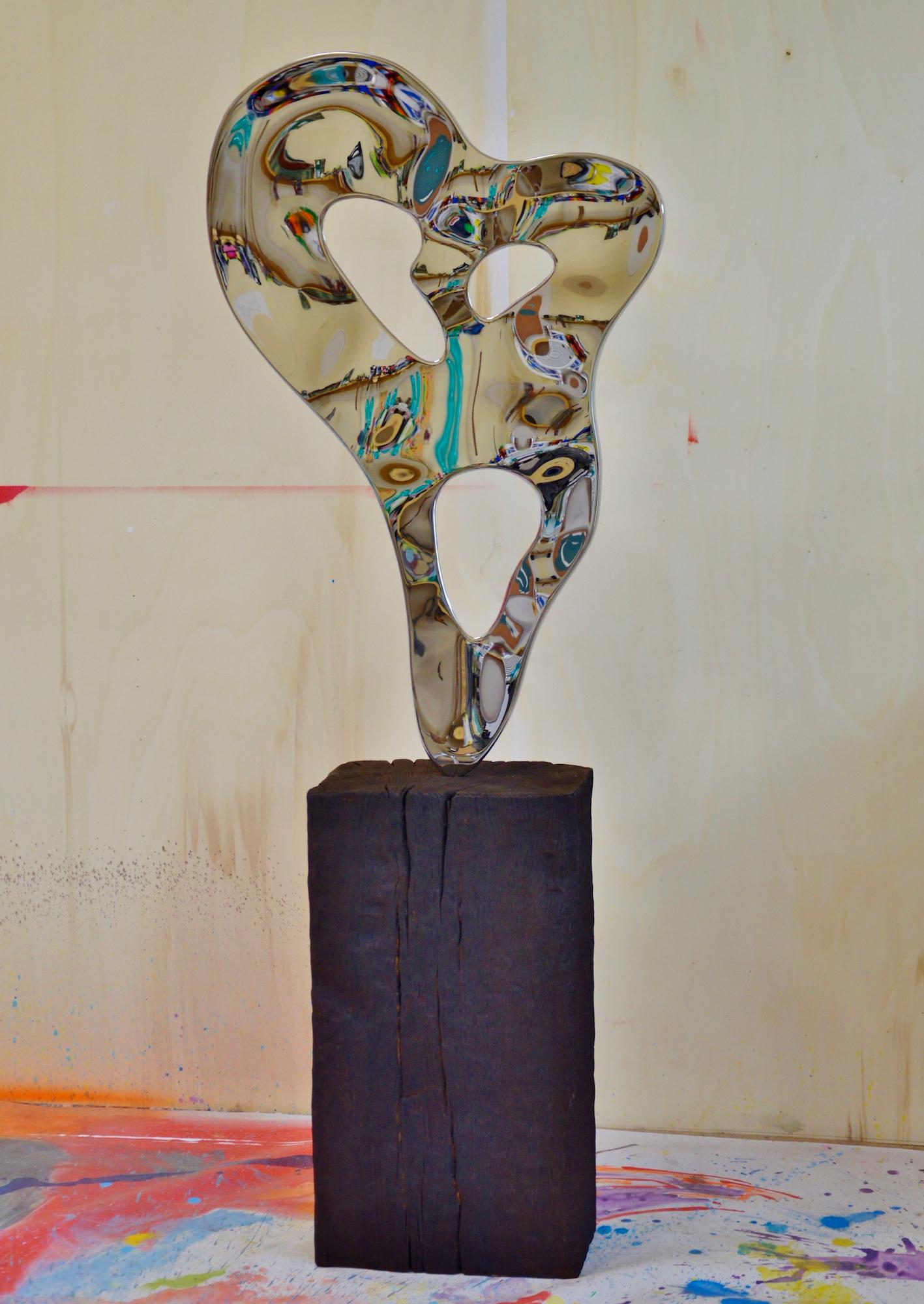 Ectoplasm II is a unique mirror-polished stainless steel sculpture and burnt oak wood base by contemporary artist Franck K, dimensions are 153 × 59 × 22 cm (60.2 × 23.2 × 8.7 in). 
The sculpture is signed and comes with a certificate of