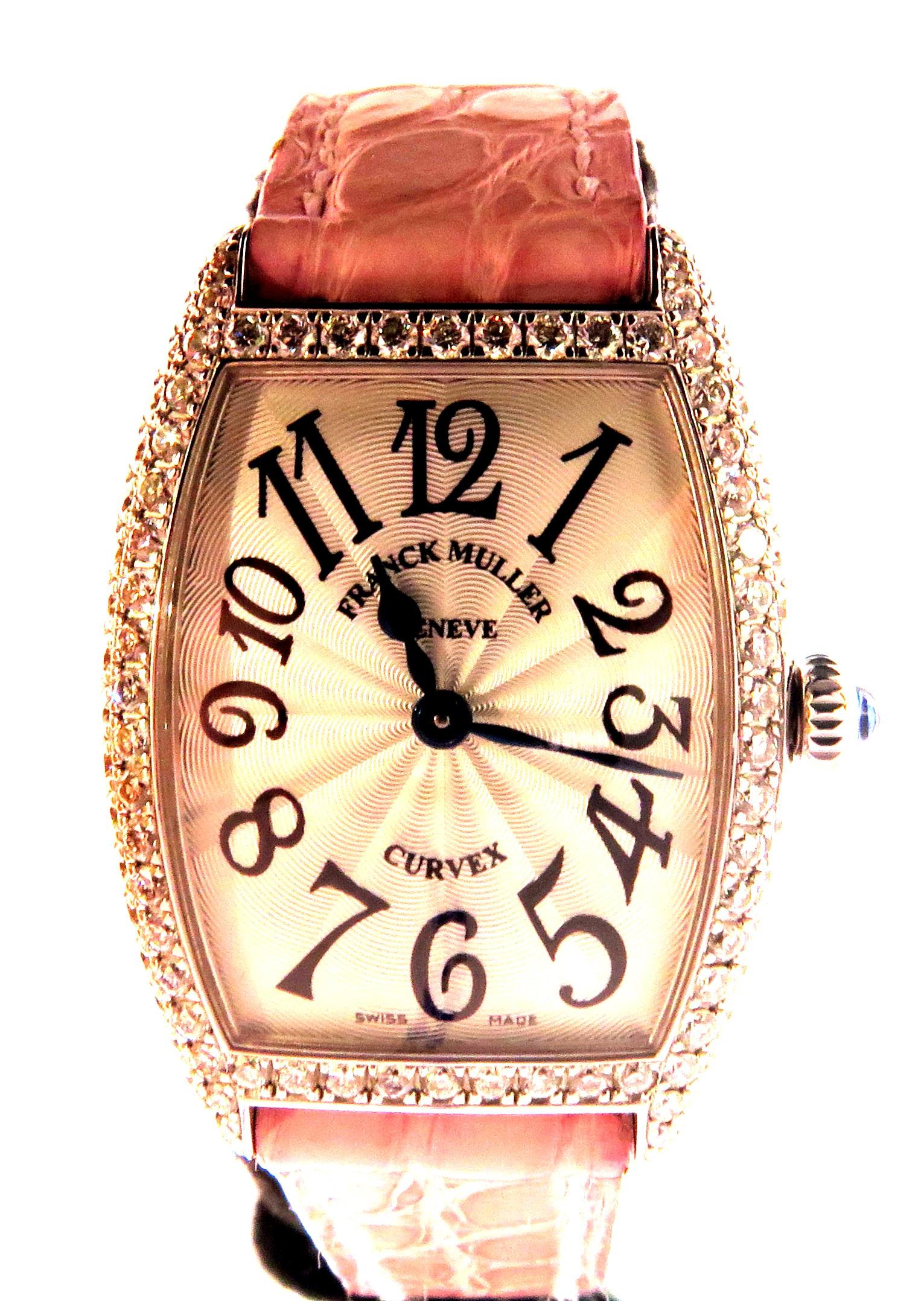 This is a 18k white gold Franck Muller quartz ladies watch with original diamonds on both the watch bezel & the clasp on the strap. This watch is pre owned & works perfectly. This watch has the original Franck Muller band which is still in very good
