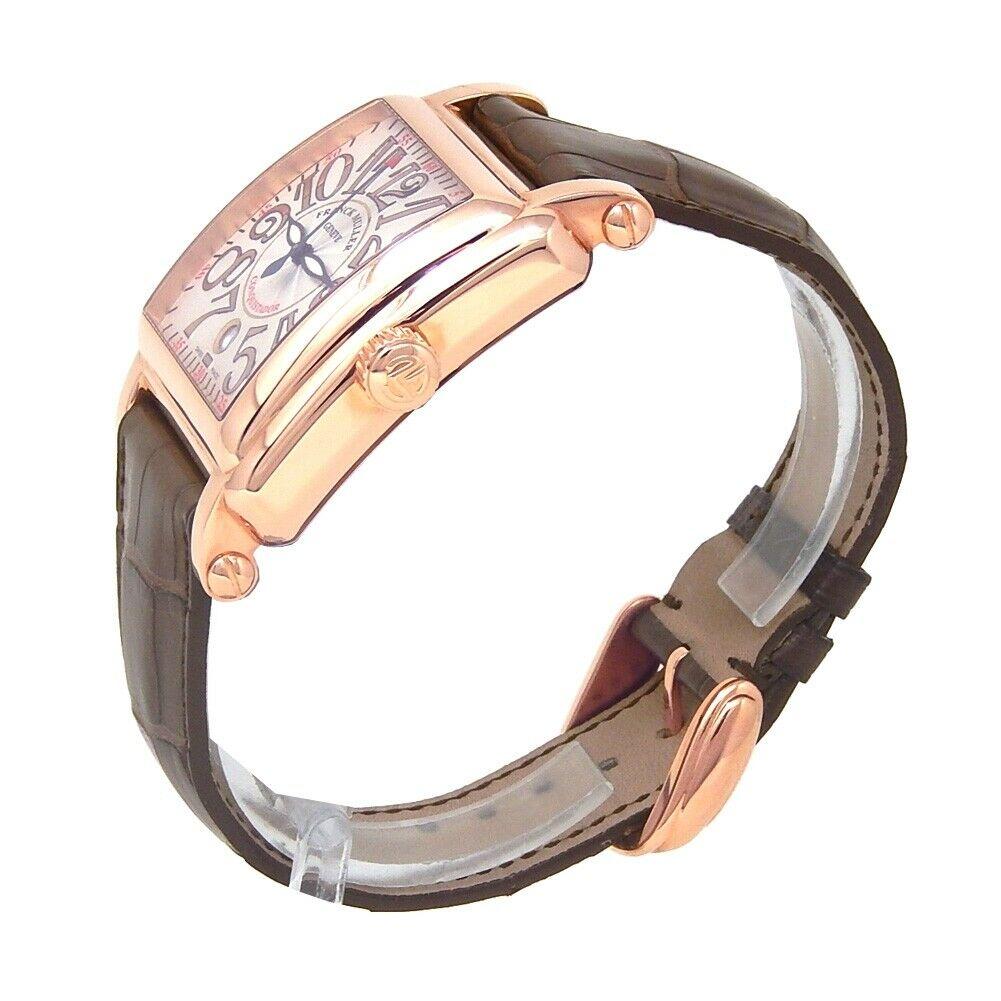 Marque : Franck Muller
Couleur de la bande : marron	
Sexe :	Hommes
Taille du boîtier : 44-47.5mm	
MPN : Ne s'applique pas
Largeur de l'ergot : 27mm	
Caractéristiques :	Cadran de 12 heures, chiffres arabes, indicateur de date, lunette en or, verre