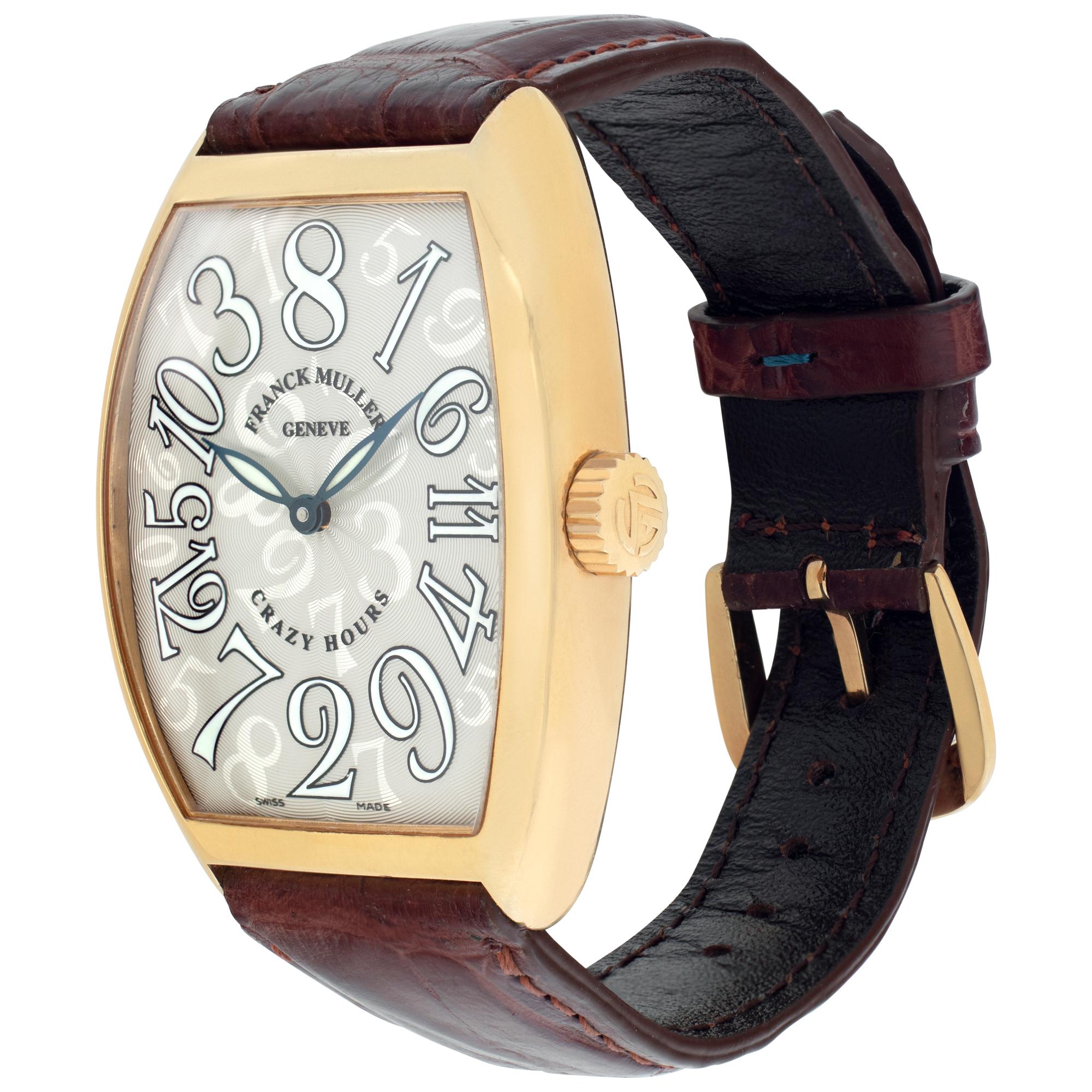 Franck Muller Crazy Hour in 18k rose gold on leather strap with FM 18k tang buckle. Auto. 34.5 mm x 41.5 mm case size. Ref 7851. Fine Pre-owned Franck Muller Watch. Certified preowned Dress Franck Muller Crazy Hour 7851 watch on a Brown Leather