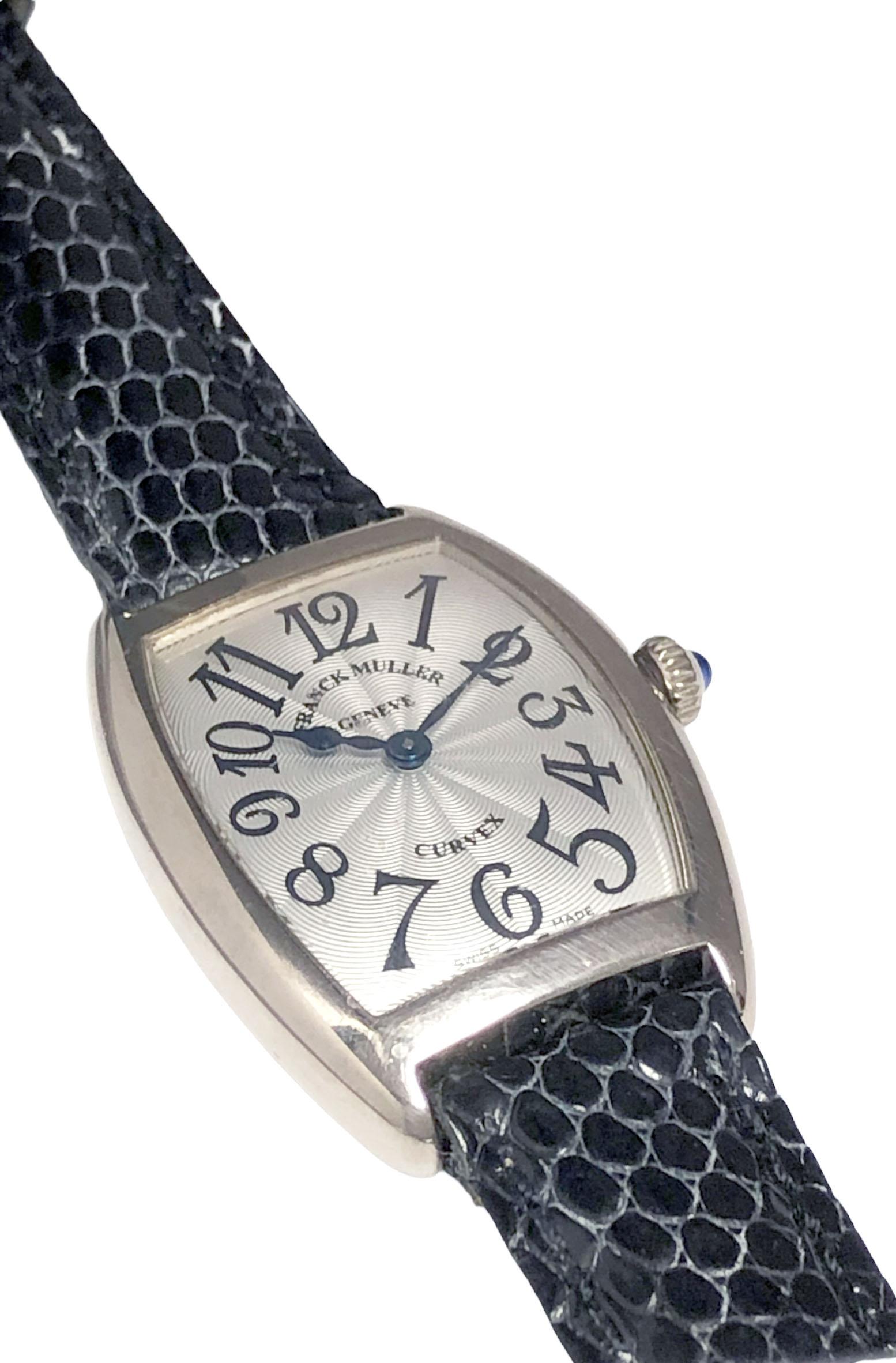 Circa 2000 Franck Muller Reference 1752 Ladies Curvex Wrist Watch, 33 X 25 M.M. 18k White Gold case, Quartz movement, Silver engine turned Guilloche dial with Black Arabic markers, Sapphire set Crown. New Black Lizard strap with original White Gold