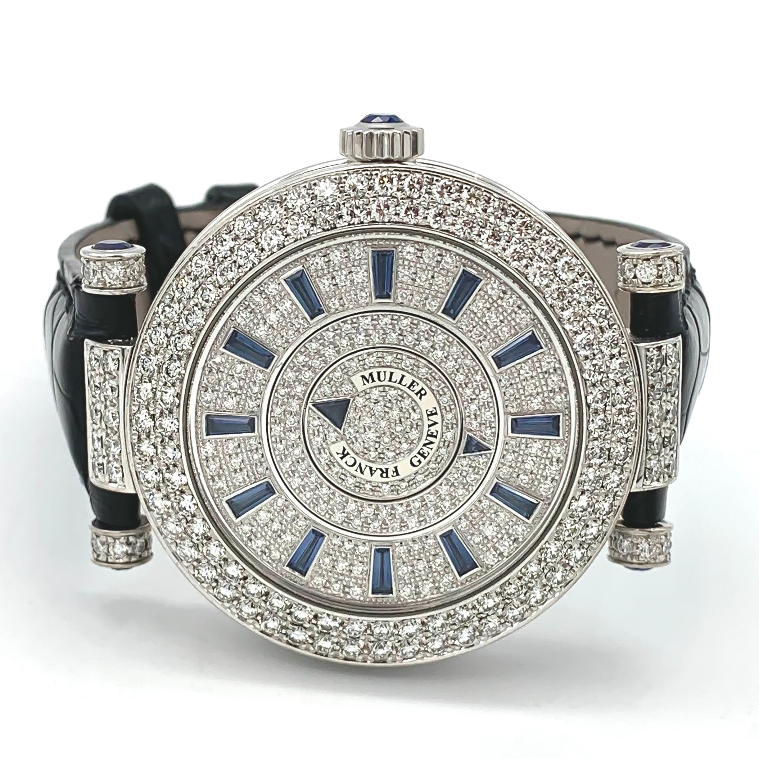 White gold case.
Diameter : 42 mm.
White diamond-paved dial.
A scratch resistant sapphire crystal protects the dial.
This timepiece indicates hours and minutes via two rotating discs on the diamond-paved dial with sapphire indexes.
Water resistance