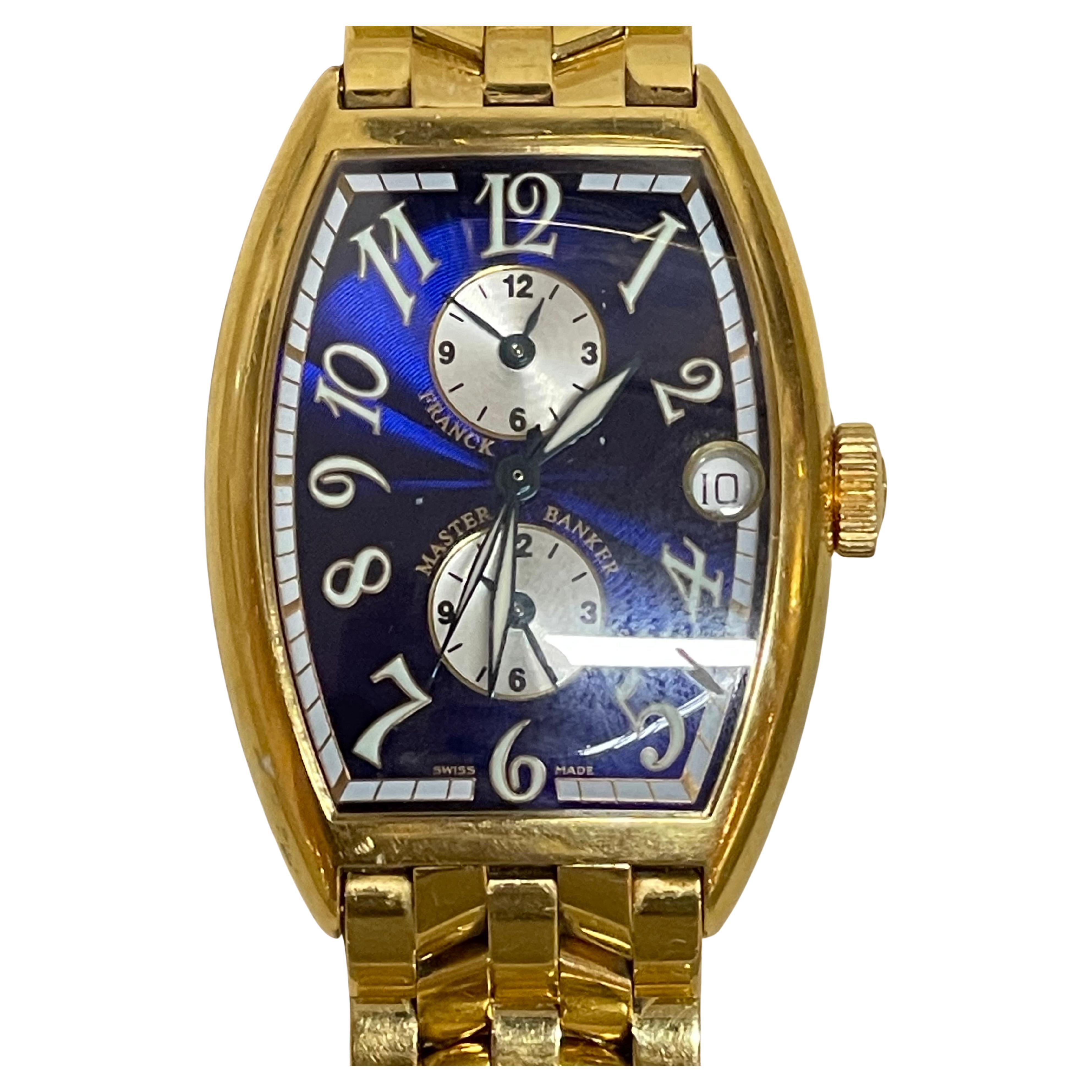 Franck Muller Master Banker 18k Rose Gold/ Gold Blue Dial Montre automatique pour hommes 5850 MB
Taille du poignet : 6.5-7 pouces
Poids : 166 grammes
Indices : Chiffres arabes
Matériau du boîtier:18k  Or rose/ Or, fond du boîtier fixé par quatre