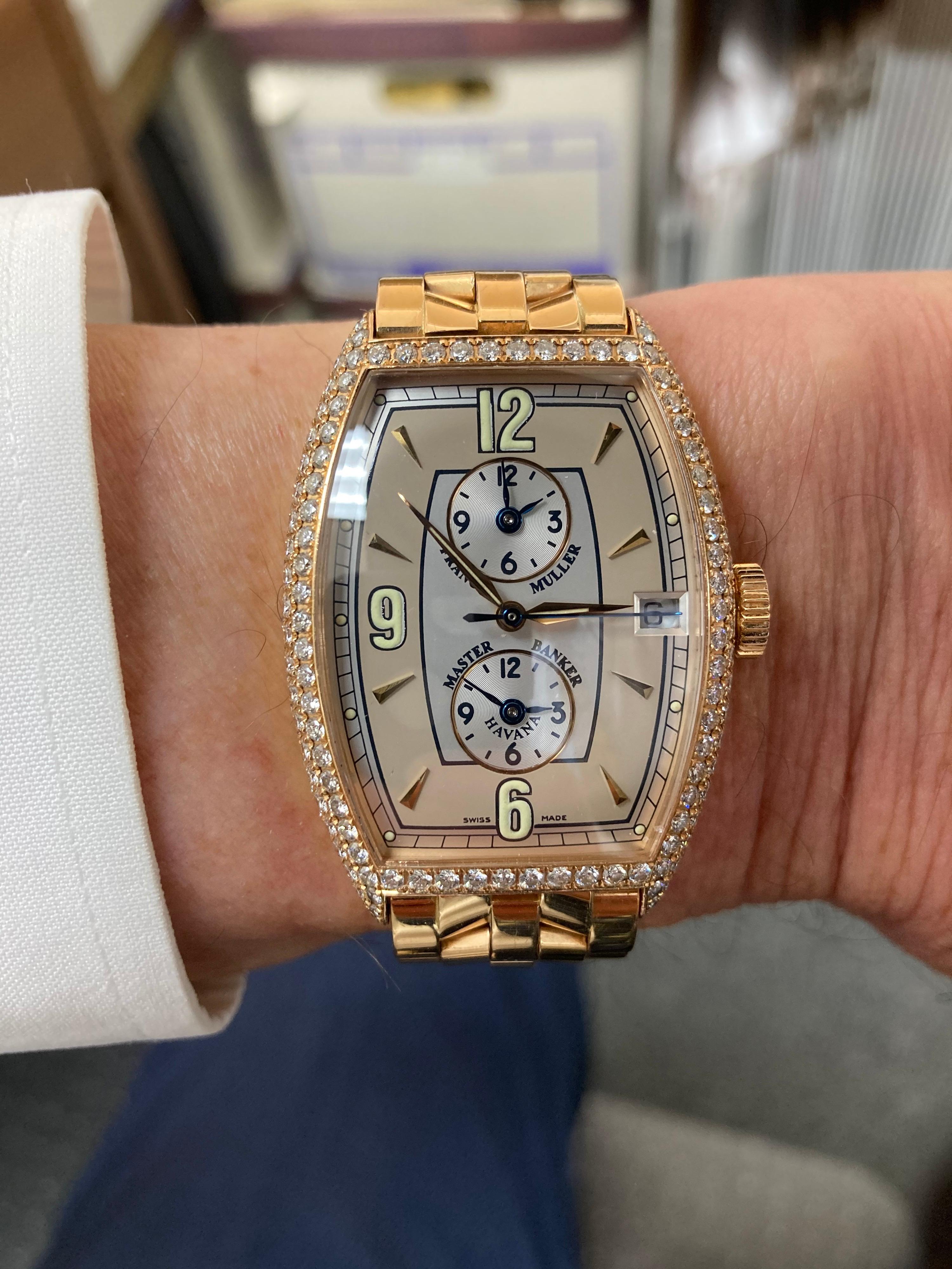 Franck Muller Master Banker 8850 Havana Model with diamond case in 18k pink gold, fits a small wrist size.  This is an automatic 3 time zone wristwatch with date.
CASE SIZE: 31.5mm by 44.5mm (1.25