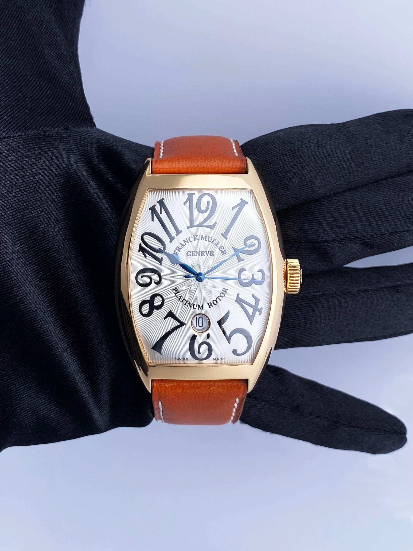 Franck Muller Master of Complications 8880 SC DT Watch. 39mm 18K rose gold case. 18K rose gold smooth bezel. Sliver dial with blue steel hands and Arabic numeral hour markers. Date display at 6 o'clock position. Brown leather strap with 18K rose