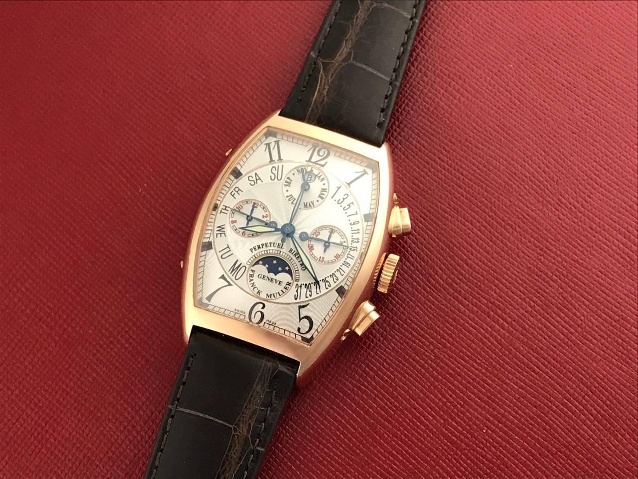 Stunning Franck Muller Perpetual Calendar, Moonphase, Chronograph Men's certified pre-owned automatic wrist watch, Model 6850 CC QPB with moonphase complication. Features a silvered guilloche dial with black arabic numerals, 18K rose Gold