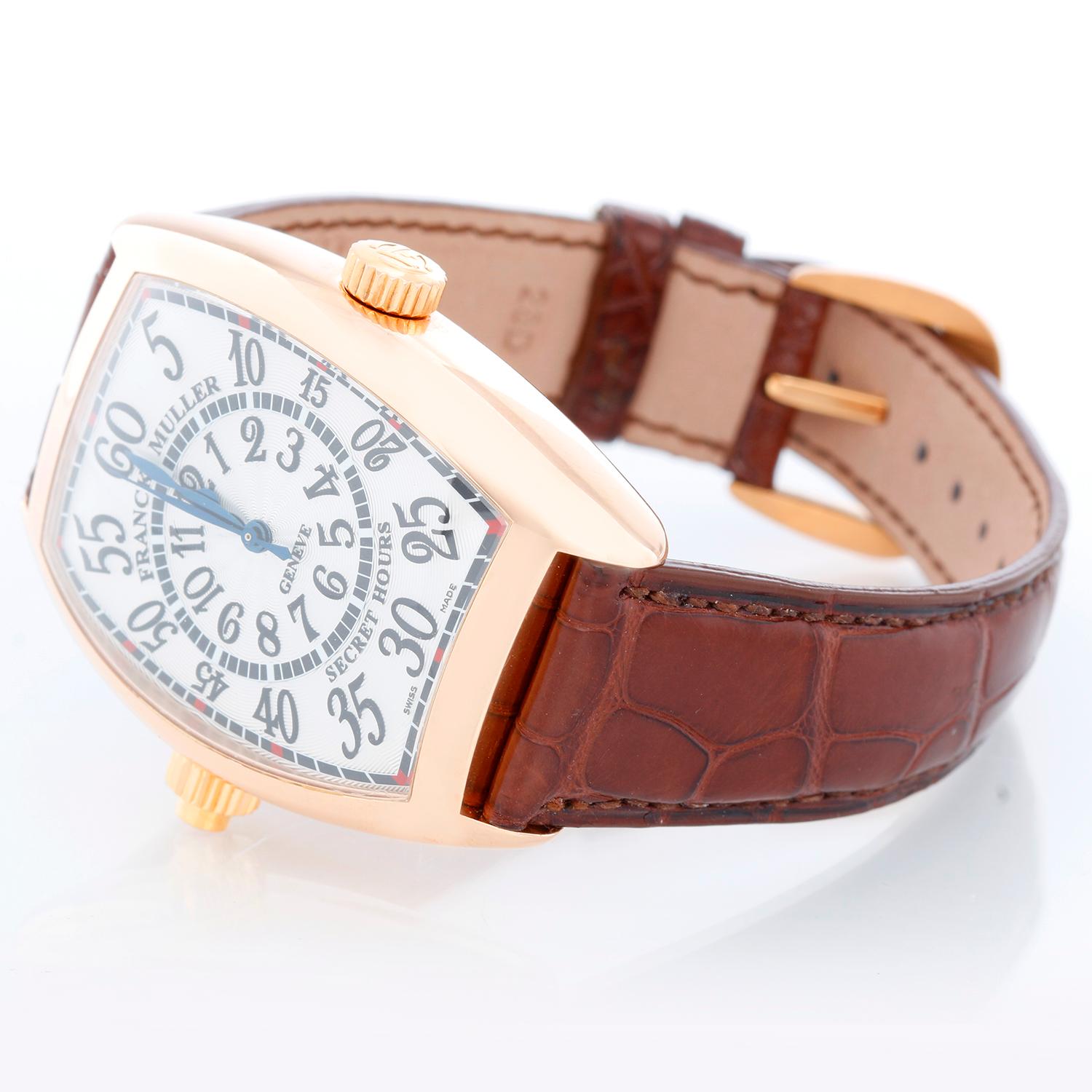 Franck Muller Secret Hours 18K Rose Gold Watch - Automatic. 18K Rose gold case; tonneau ( 36 mm x 50 mm ). Silver dial with secret hours numerals. Brown Alligator strap with tang buckle. Pre-owned with Franck Muller box and papers . 