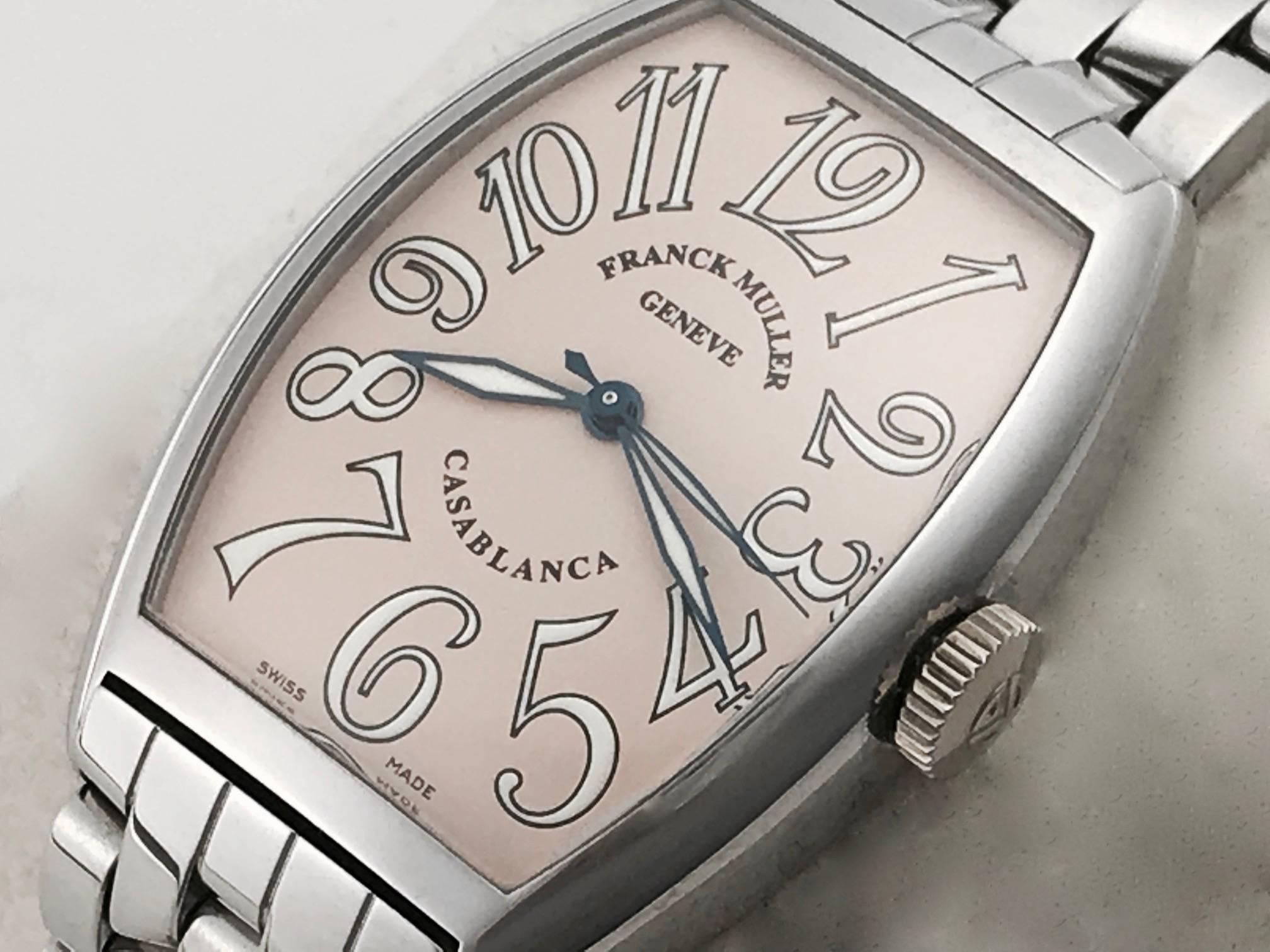 Stunning Franck Muller Men's never worn automatic wrist watch, Model 5850. Features a Salmon Dial with white and black arabic numerals, stainless steel rectangular tonneau style case and Stainless Steel Franck Muller bracelet with deployant clasp.
