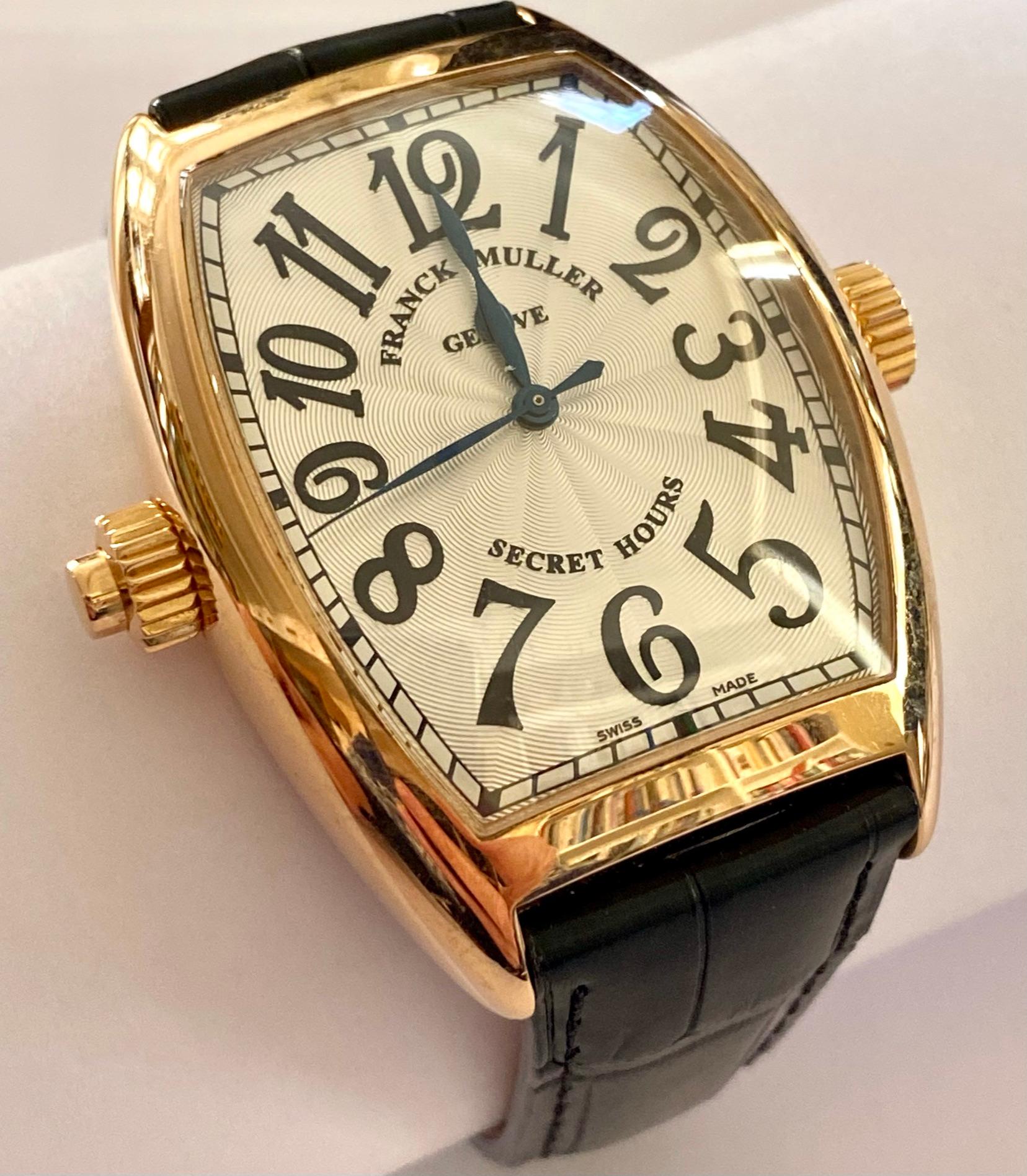 .One (1) 18K. rose Gold watch with a leather strap.
Brand: Franck. Muller
Type: Cintree Curvex
Secrecy & Ingenuity
The Secret Hours embodies the inventiveness and ingenuity of Franck Muller, and allows time to be suspended until its owner decides