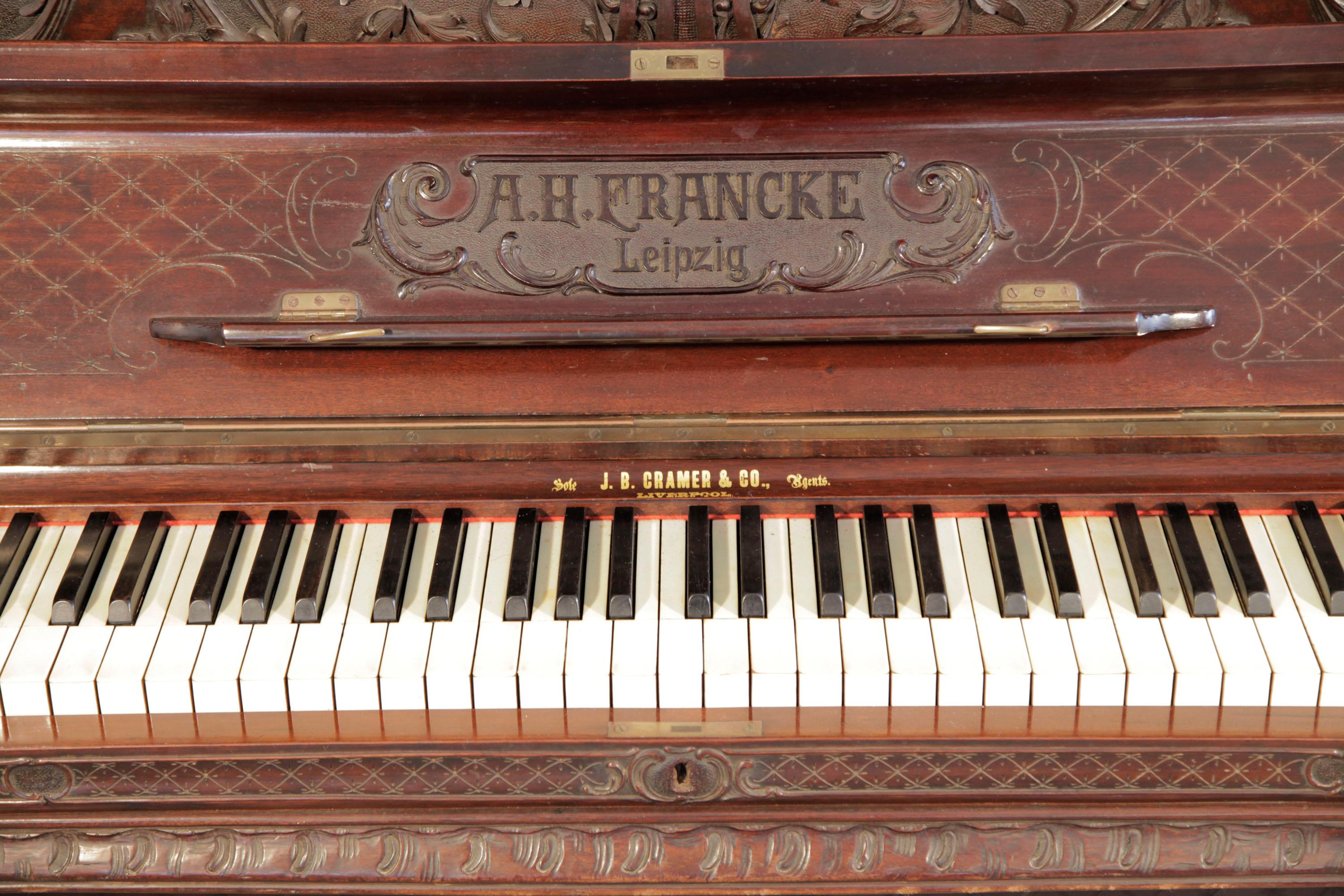 Francke Upright Piano Rococo Style Carved Mahogany High Relief Scroll Legs  For Sale at 1stDibs