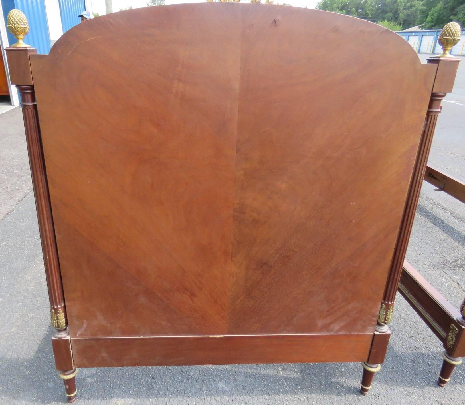 Bronze mounts. Marquetry inlay. Includes headboard, footboard and rails.