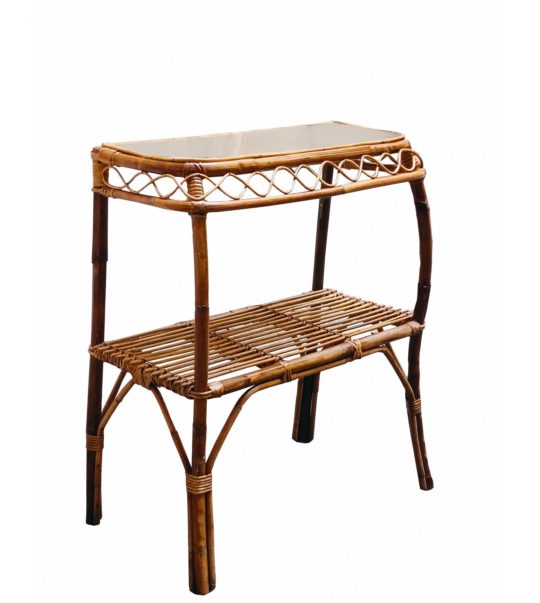 Gorgeous rattan console table with brass top. This amazing piece was produced in the style of Franco Albini in Italy during the 1960s. Entirely handmade, perfect example of 1960s Italian craftsmanship. The console table has four beautiful curved
