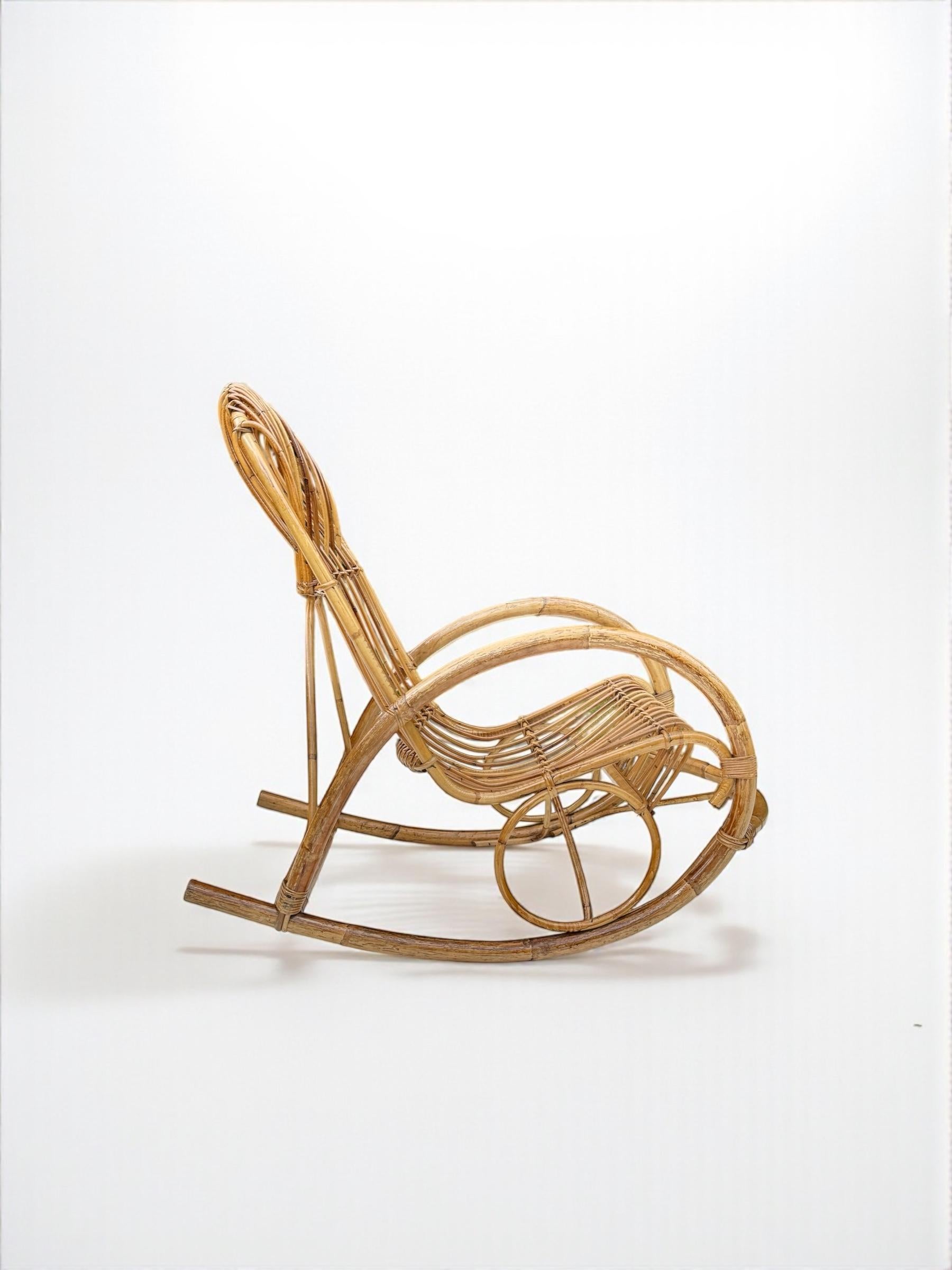 Italian designer Franco Albini specialised in the charming and beautiful in design, his take on bamboo furniture design was innovative and filled with style as in this example of a 1950's rocking chair. Very light in weight and in its aesthetics,